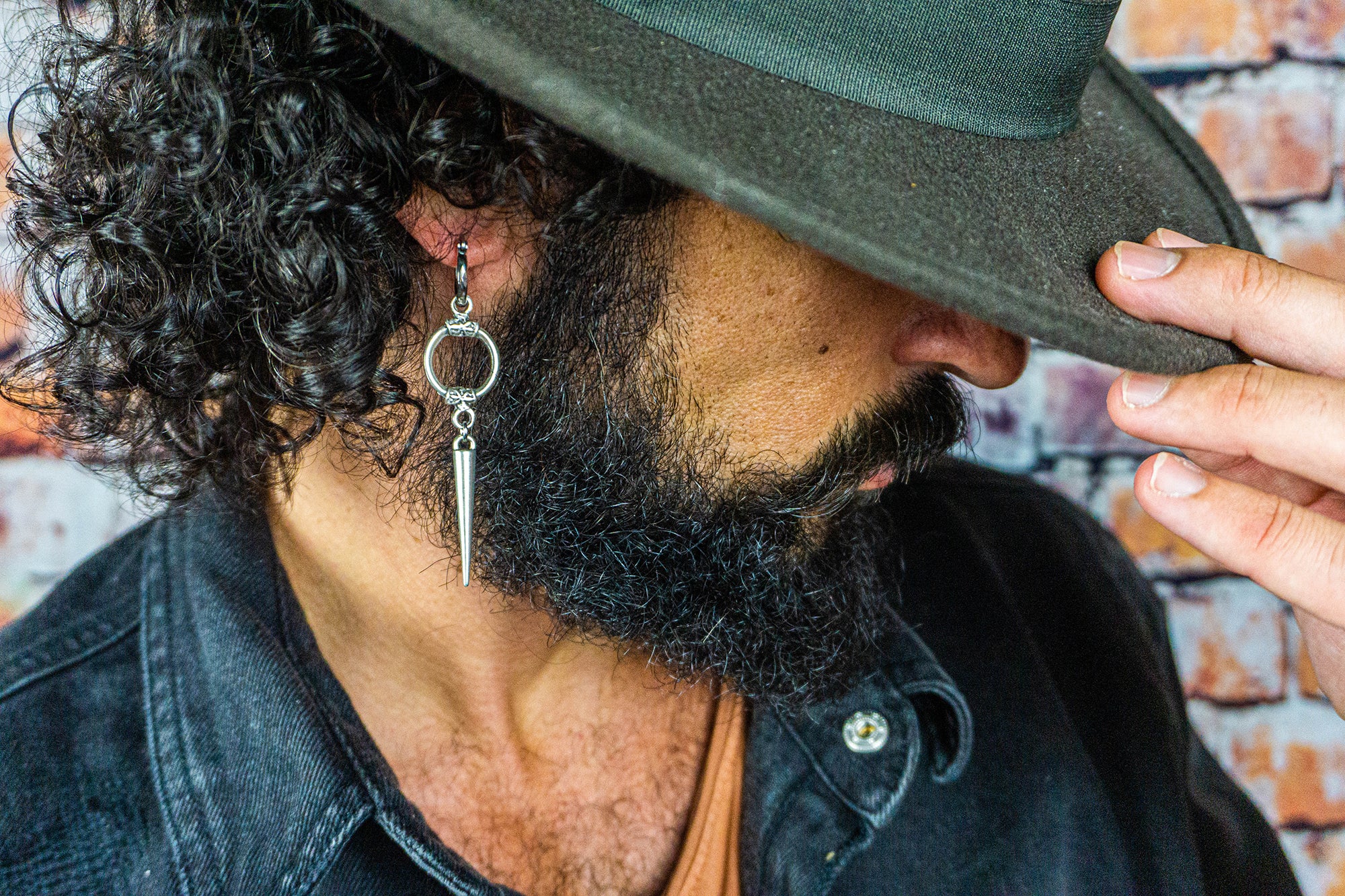 mens long silver spike earring with a circle ring in the middle- wander jewellery