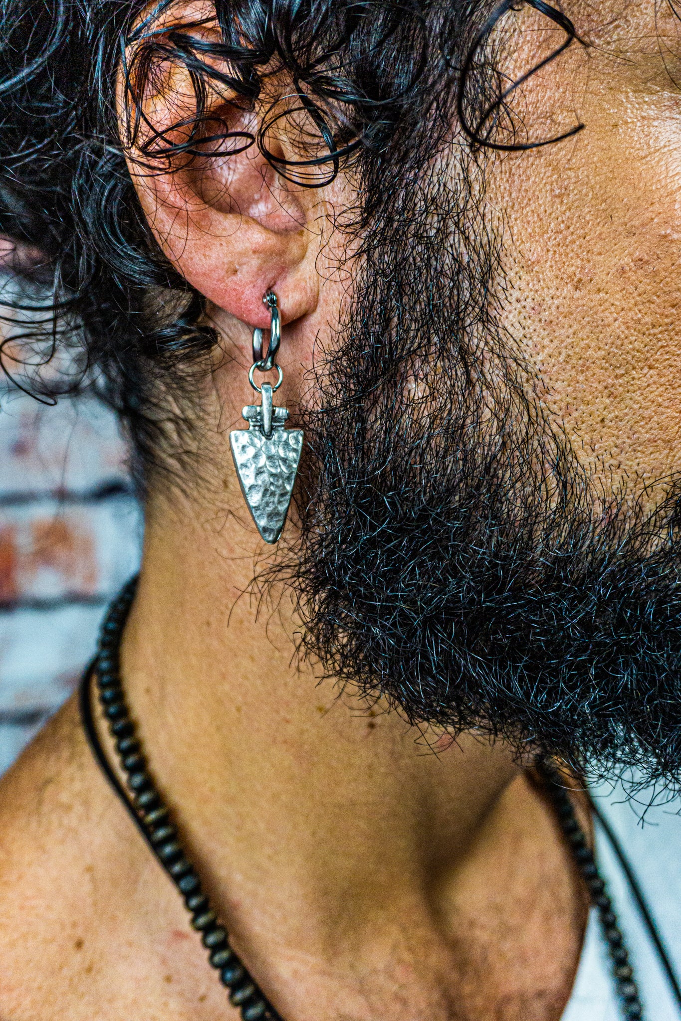 hoop earring with a silver triangle charm-wander jewellery