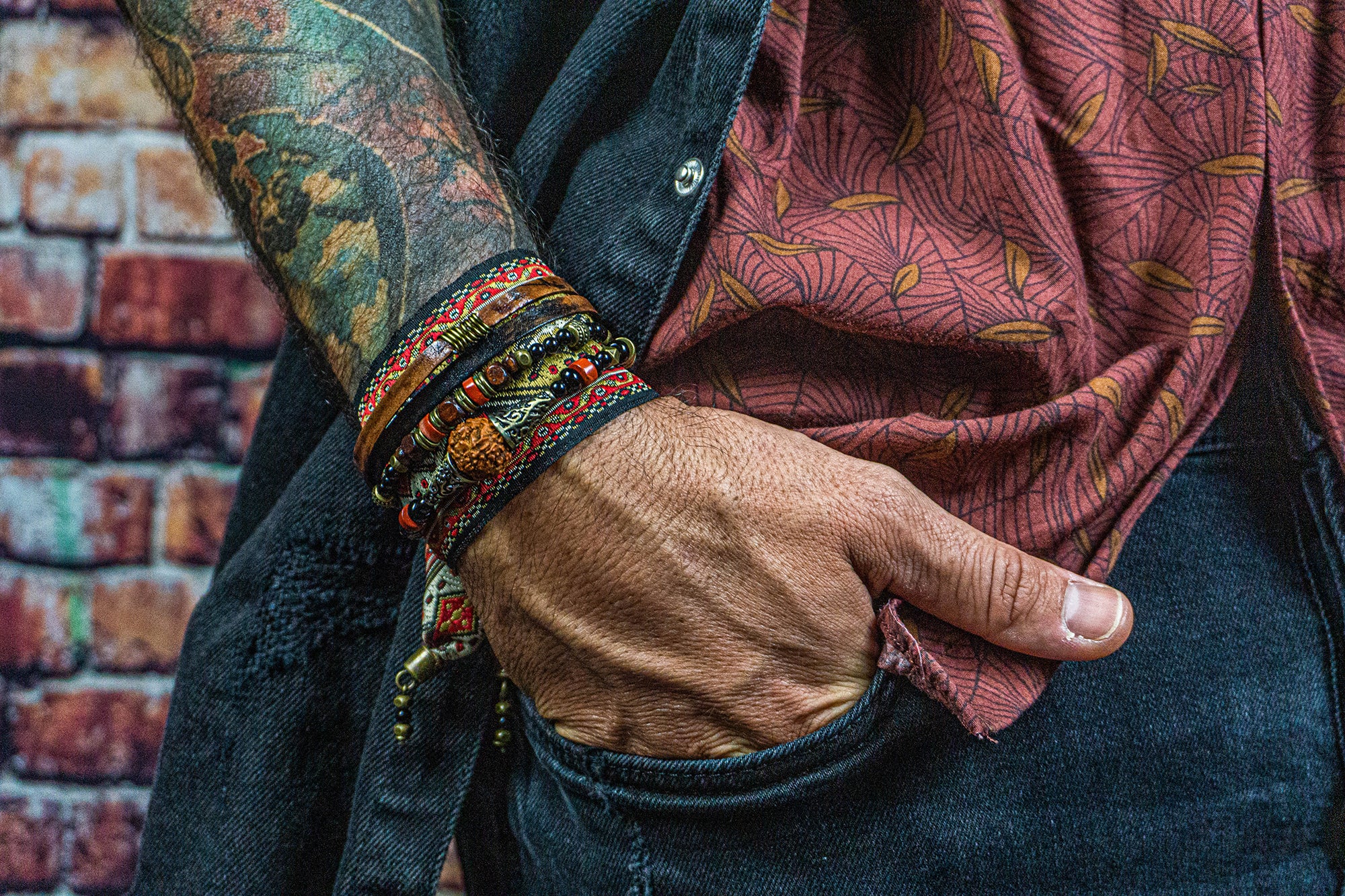 A layered rockstar pirate bracelet, a combination of red embroidery, brown leather and gemstone beads- wander jewellery