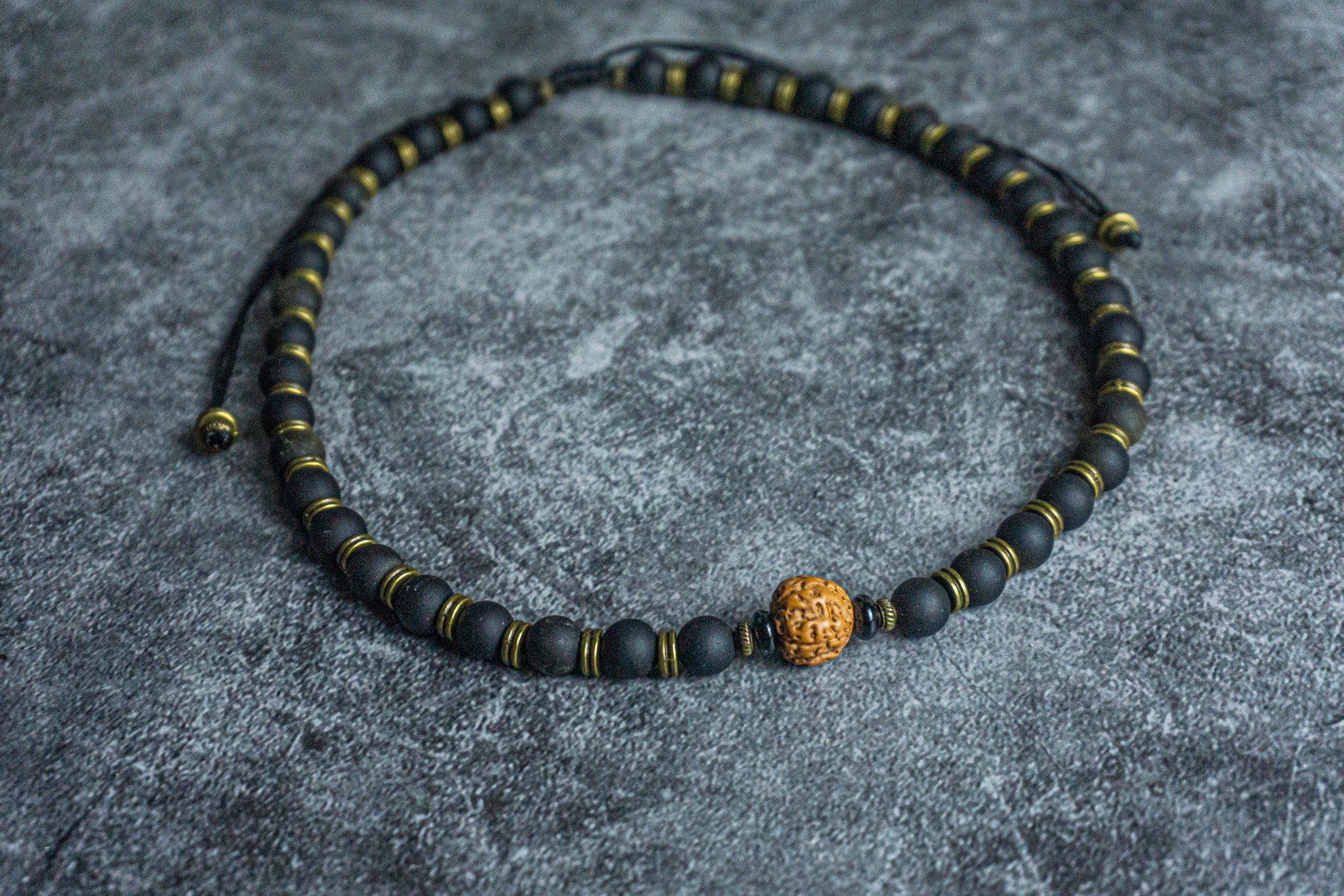 black golden obsidian beaded necklace with brass spacers and rudraksha sees as central piece- wander jewellery
