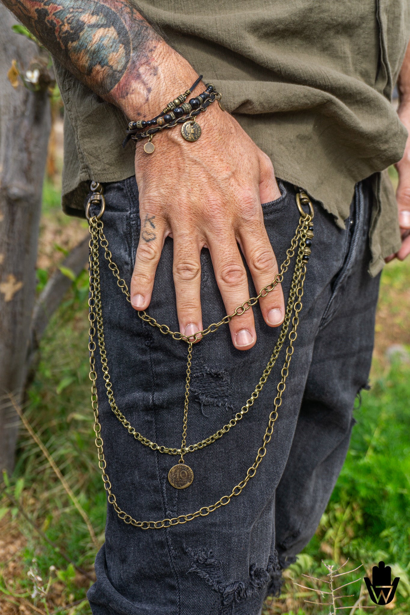tattooed man wearing pants chain