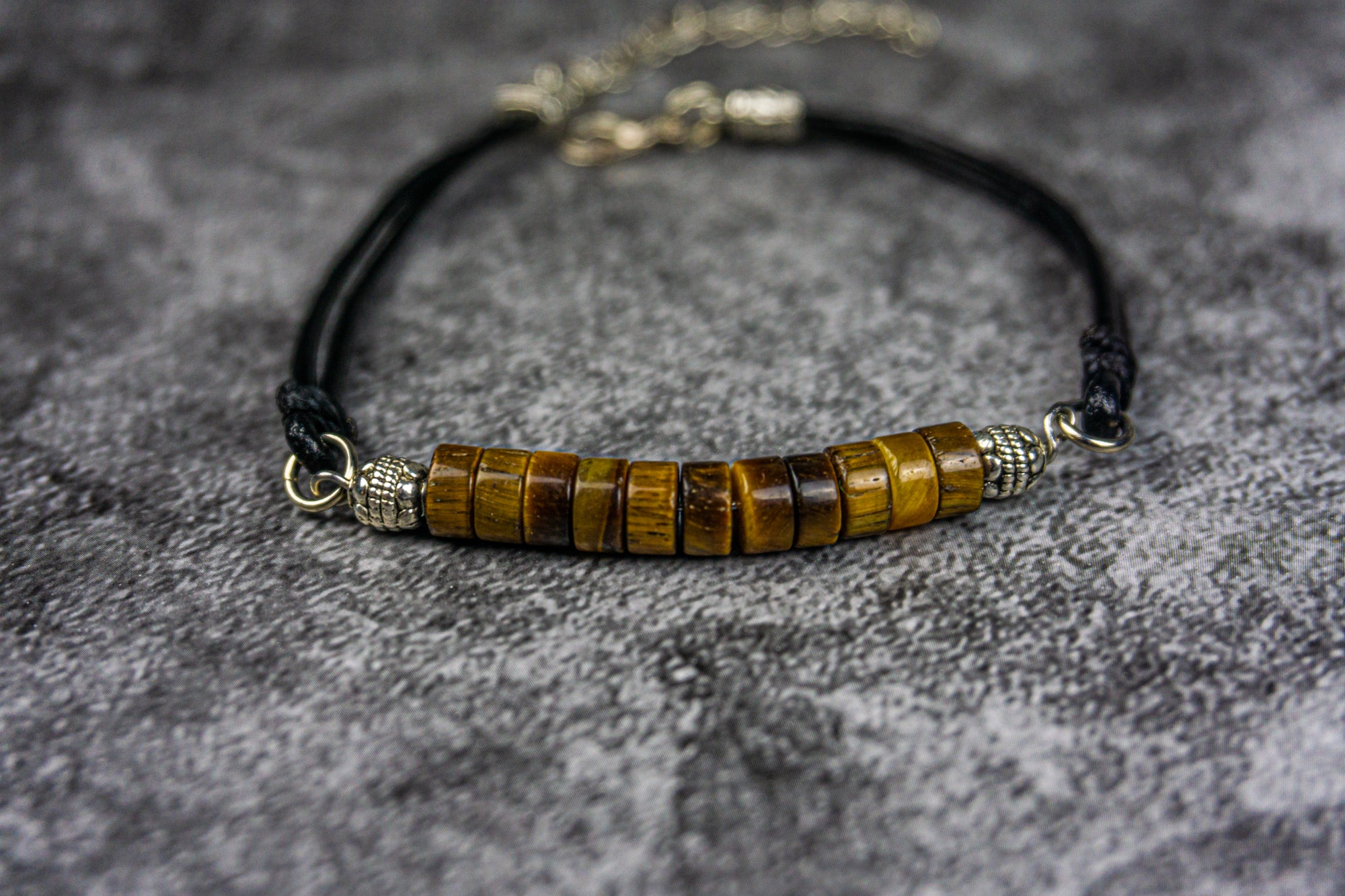 black leather bracelet with tiger eye heishi gemstone beads and silver details- wander jewellery
