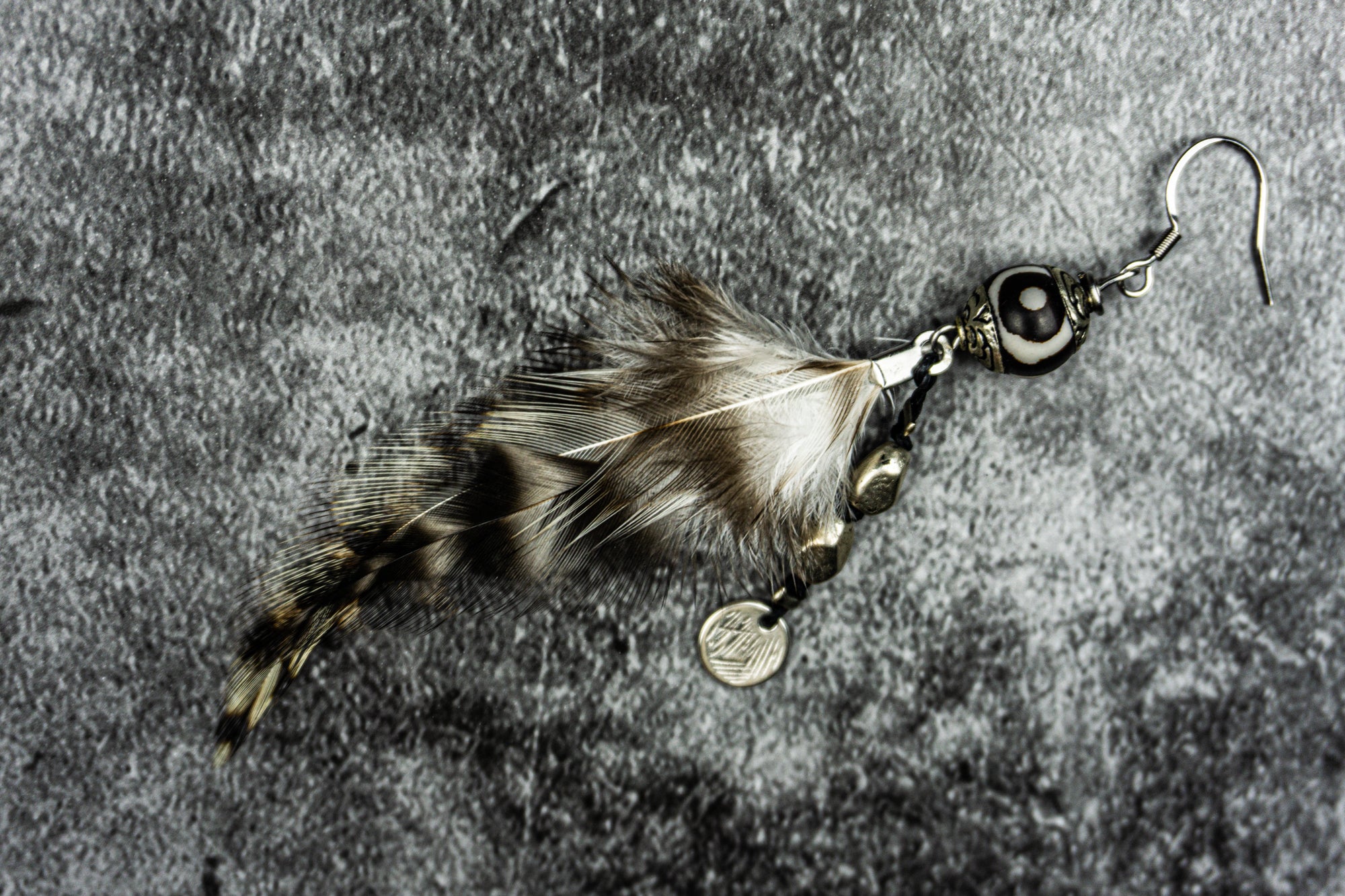 long black and white feather with Tibetan Agate gemstone and silver colored nugget and coin charms- wander jewellery