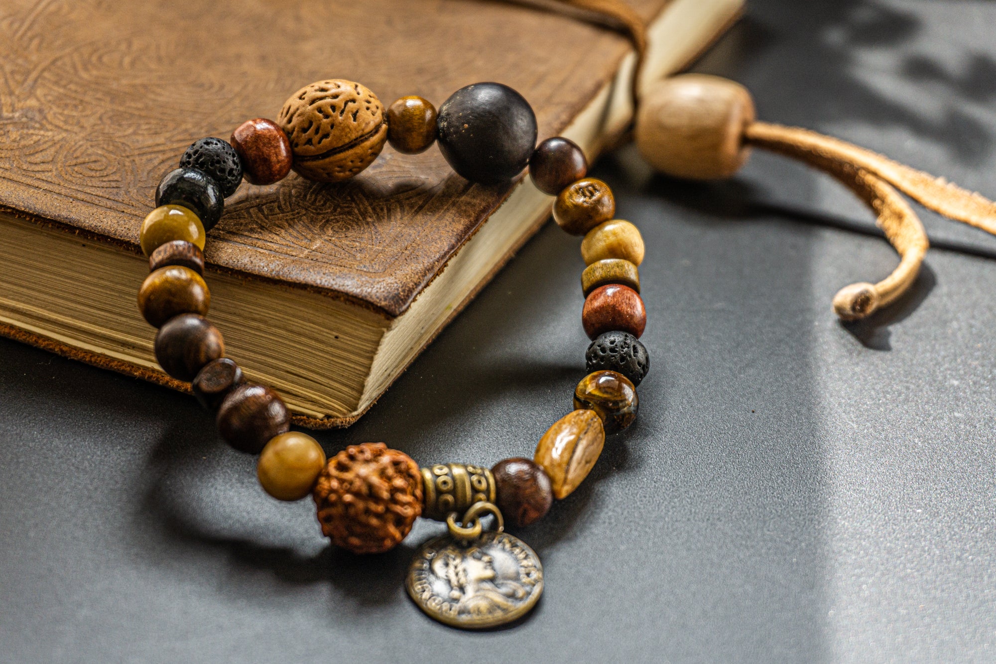 wood and seed beaded bracelet with ancient coin charm- wander jewellery