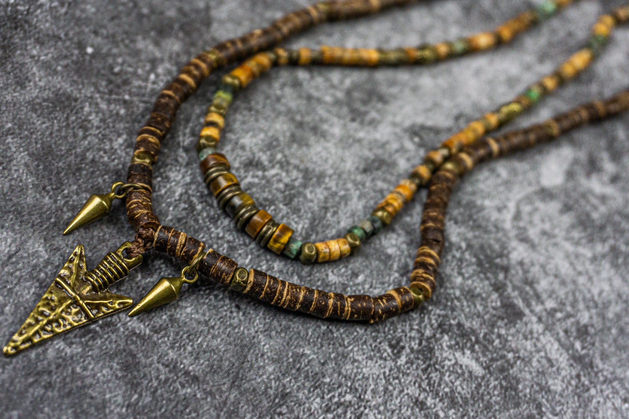 double necklace set made of jasper and tiger eye, plus a coconut necklace with and arrowhead pendant- wander jewellery