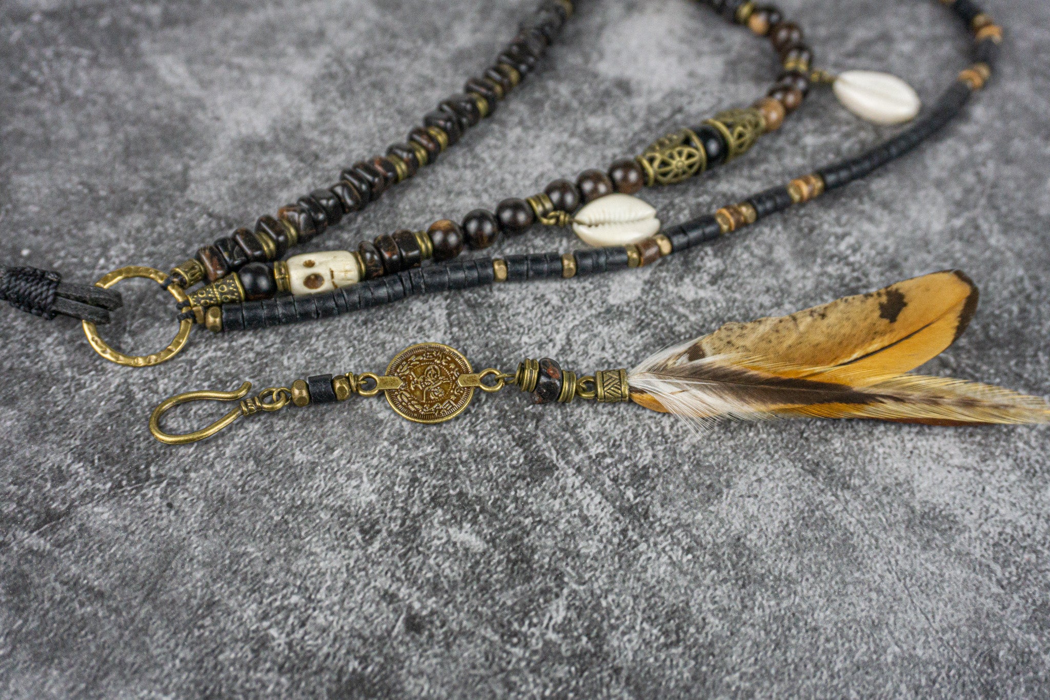 black layered pirate necklace set with skull shell and feathers- wander jewellery