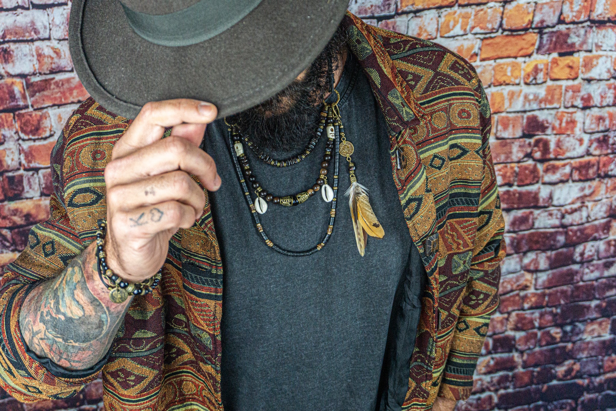 mens black multi strand necklace set with skull shell and feathers- wander jewellery