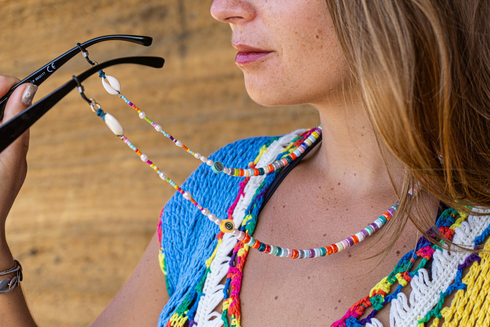 Vibrant beaded glasses chain holder for women with porcelain beads, pearls, and cowrie shells, wrapped in eco-friendly packaging – Wander Jewellery