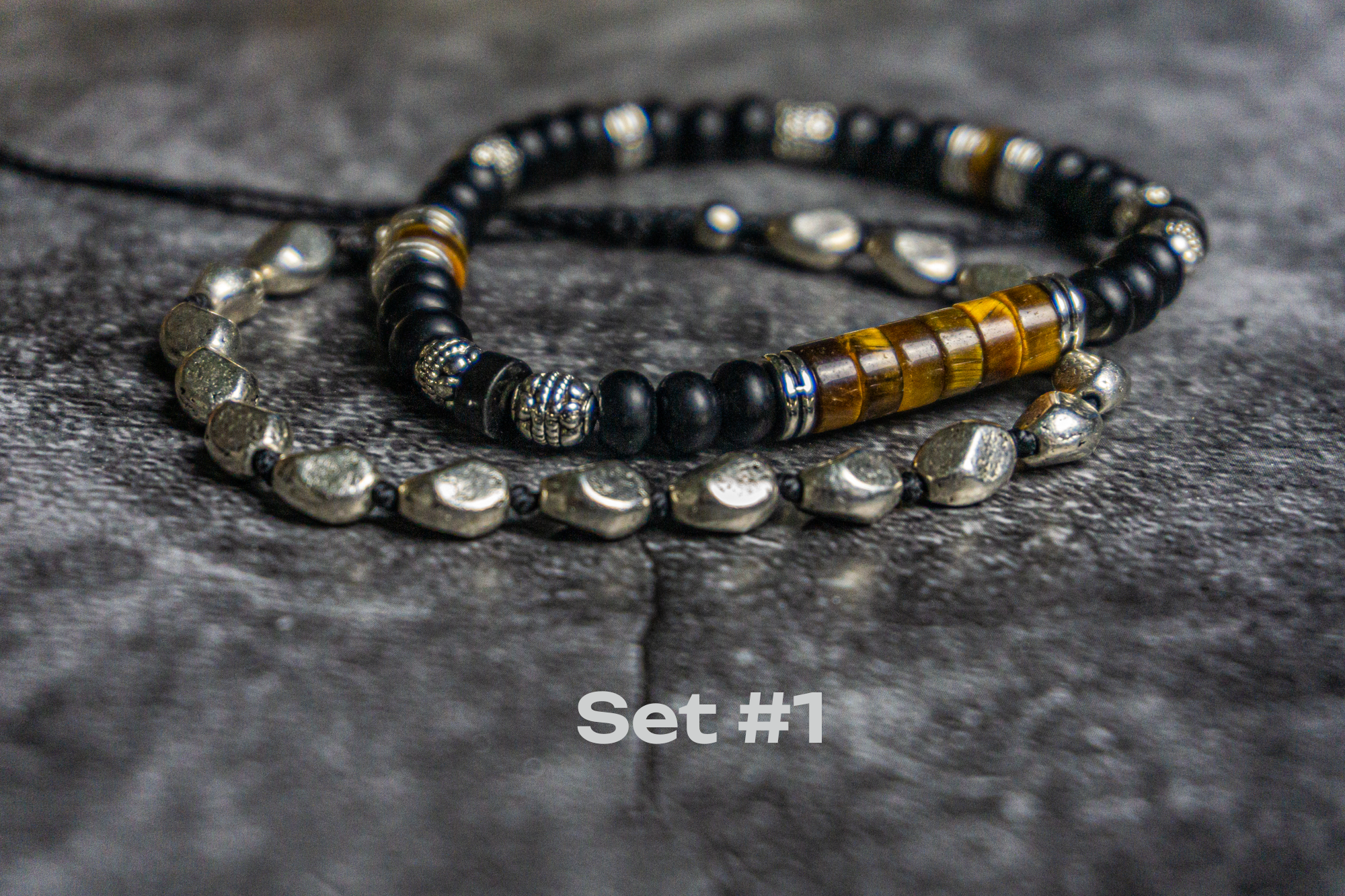 bracelet set made of one onyx and tiger eye bracelet and one silver colored adjustable bracelet- wander jewellery