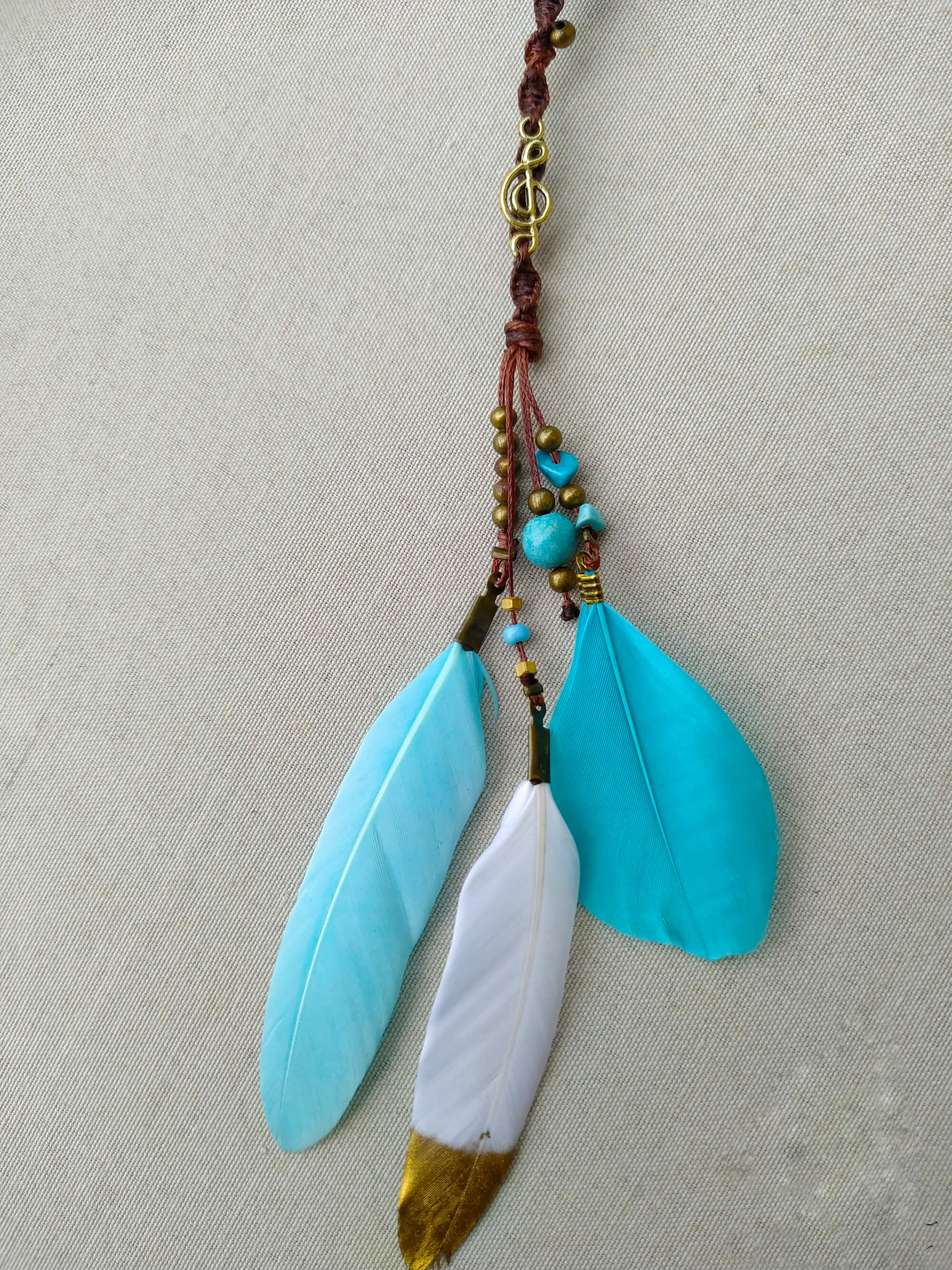 brown macrame woven hair wrap with turquoise feathers- wander jewellery