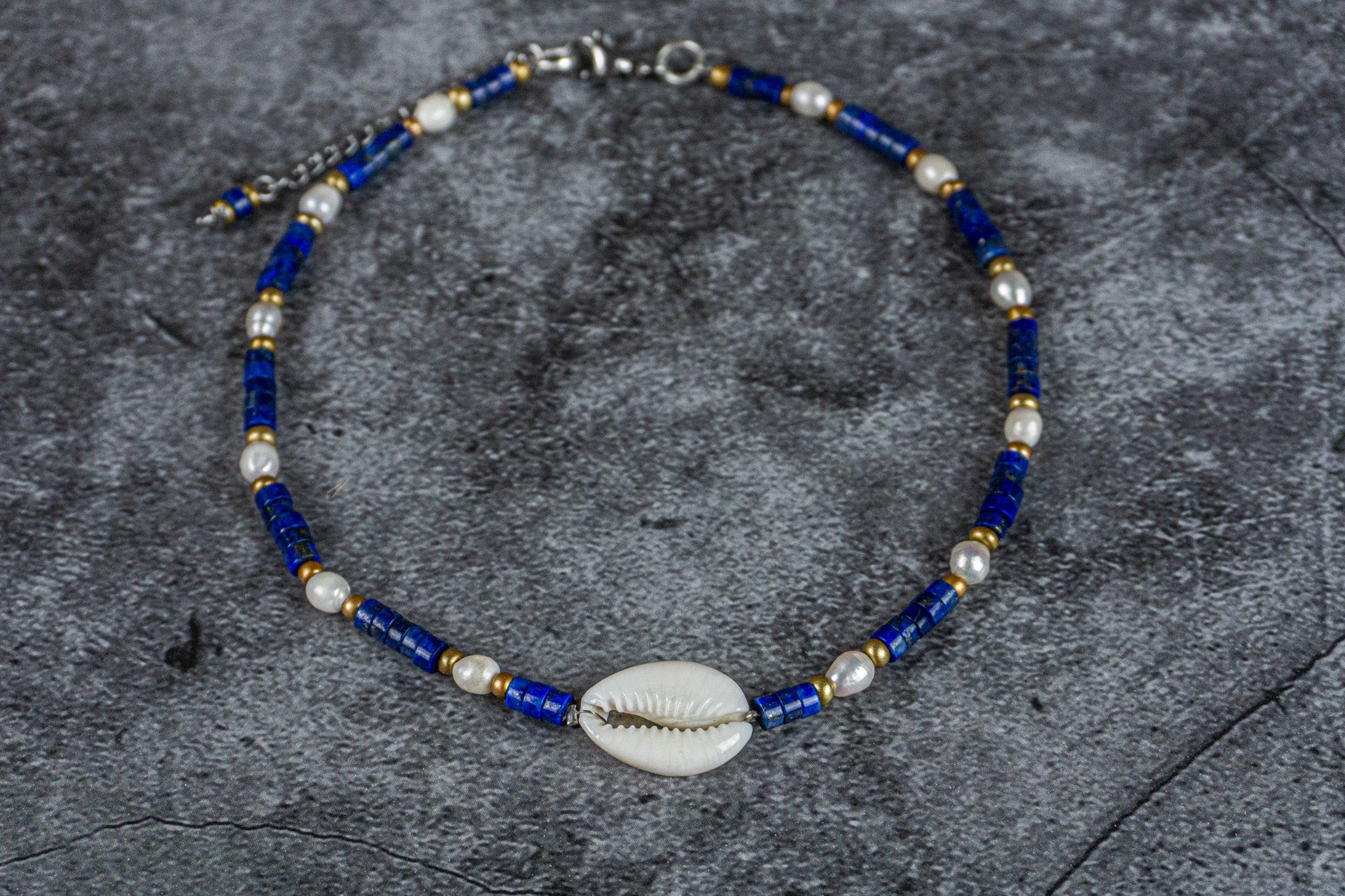 boho chic choker made of lapis lazuli heishi beads gemstone, pearl and a cowrie shell as a central piece- wander jewellery