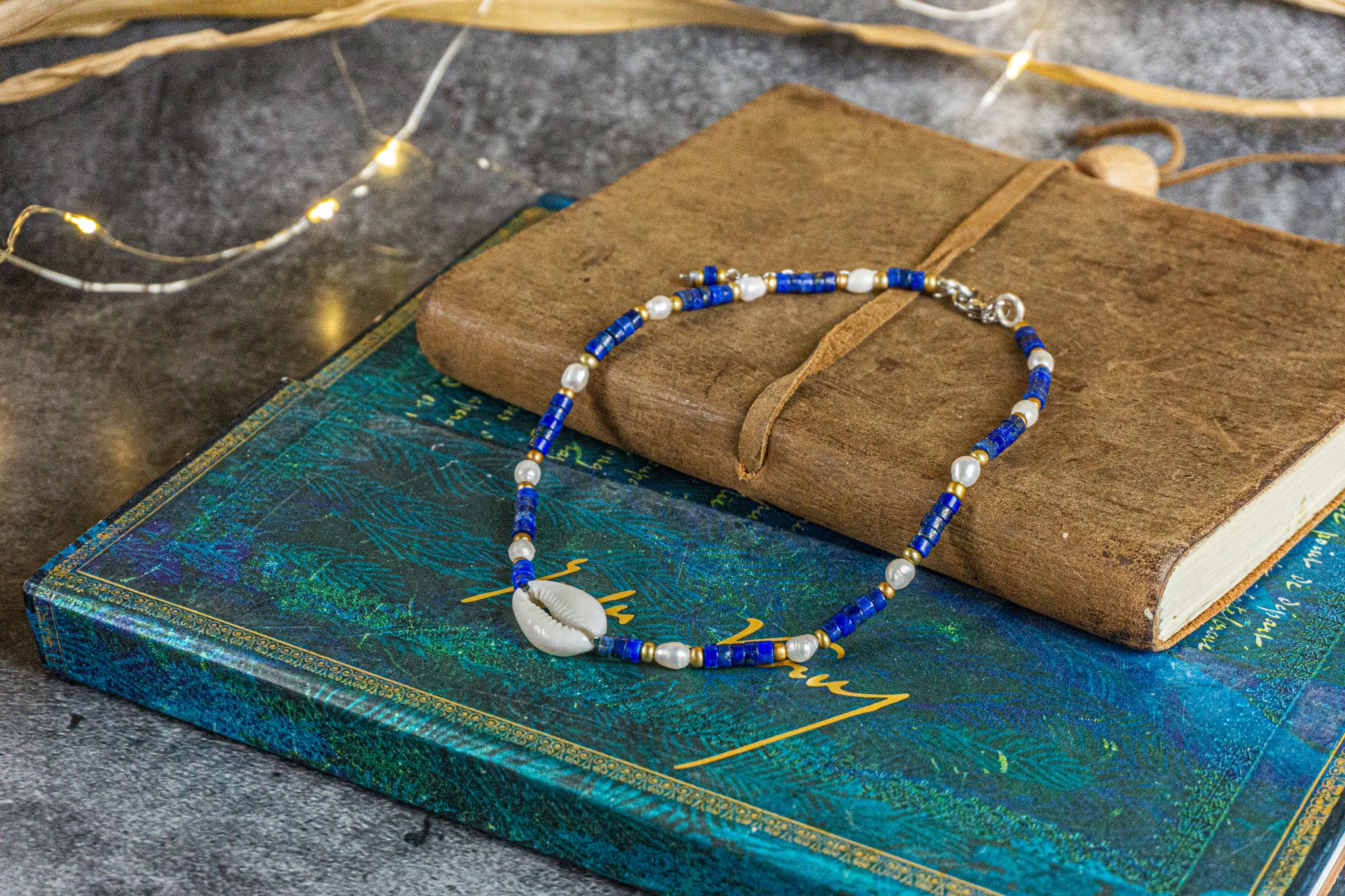 boho chic choker necklace made of lapis lazuli heishi beads gemstone, pearl and a cowrie shell as a central piece- wander jewellery