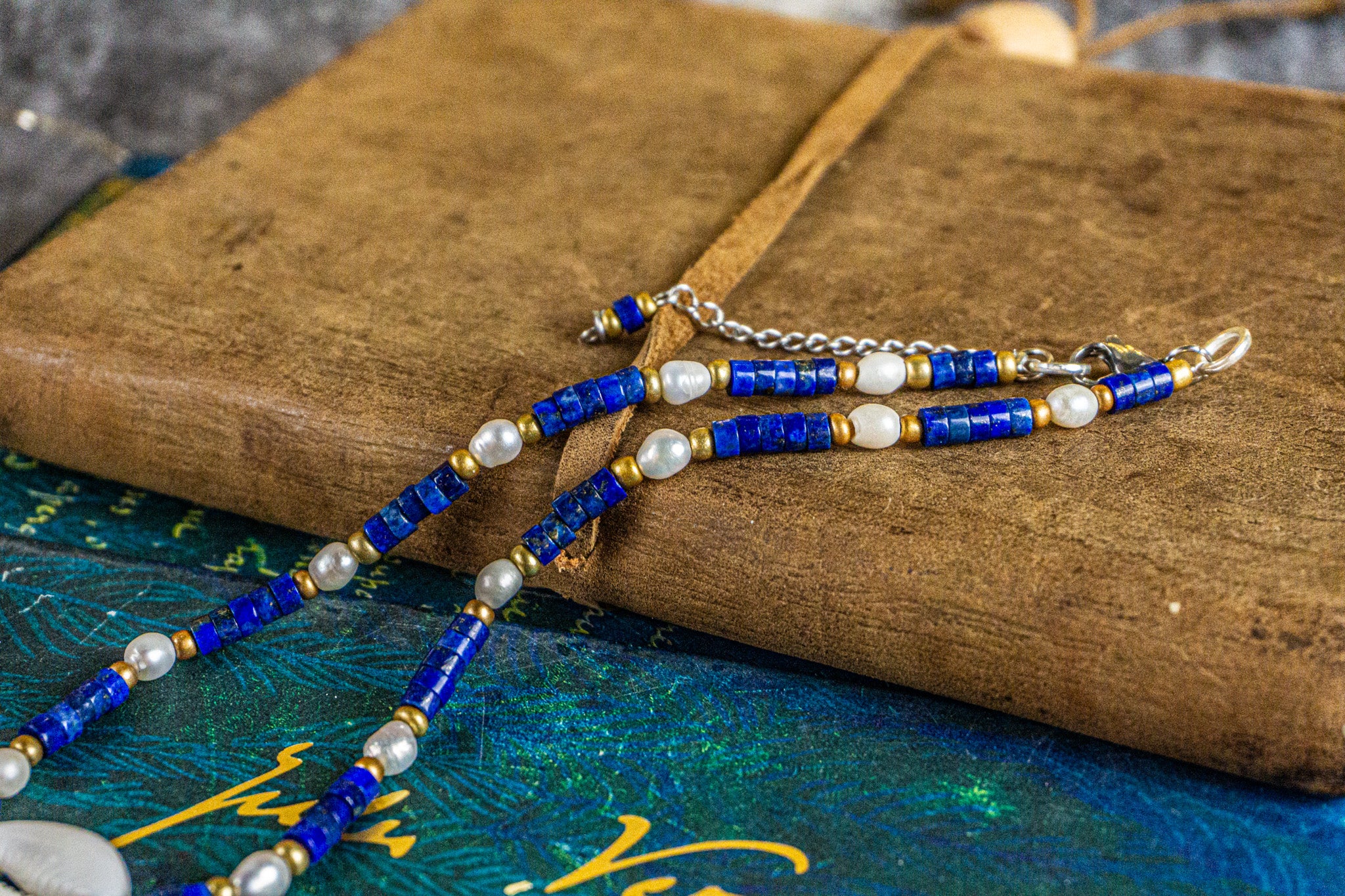 boho chic choker made of lapis lazuli heishi beads gemstone, pearl and a cowrie shell- wander jewellery