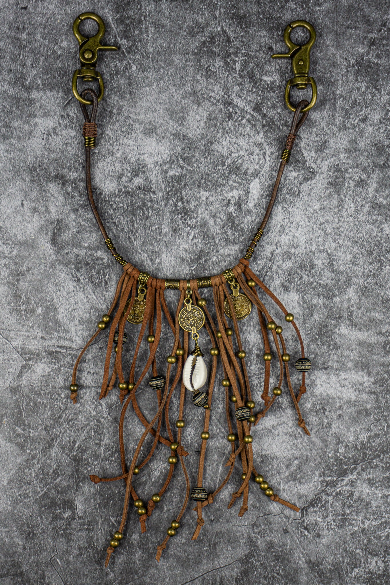 leather fringes pants chain with bronze dangle beads and coins with a cowrie shell- wander jewellery