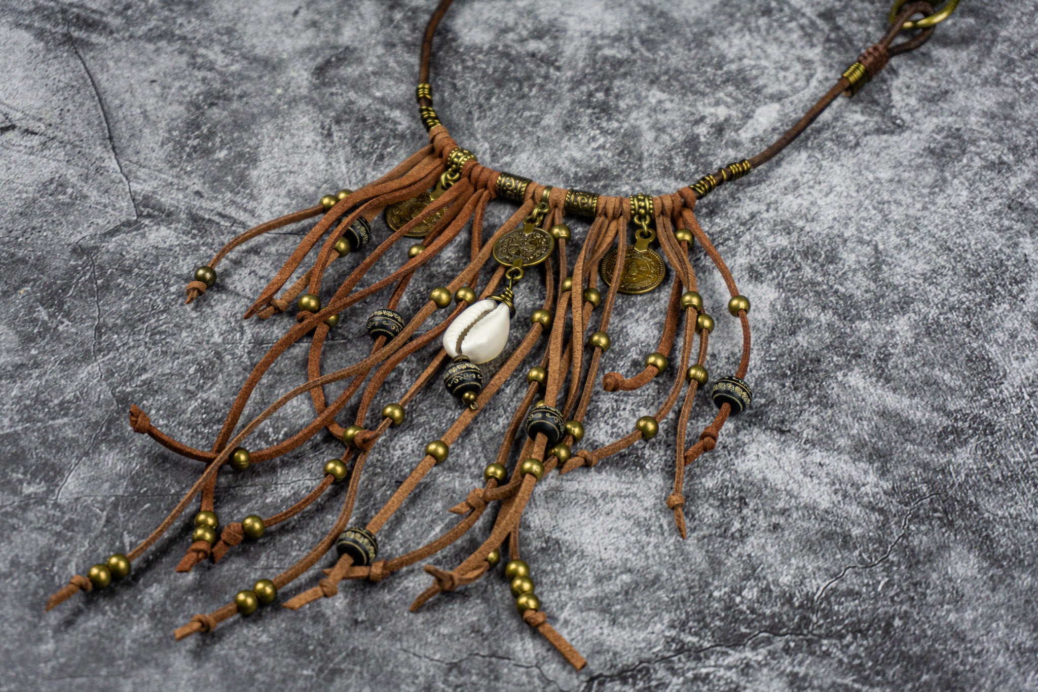 leather fringes pants chain with bronze dangle beads and charms with a cowrie shell- wander jewellery