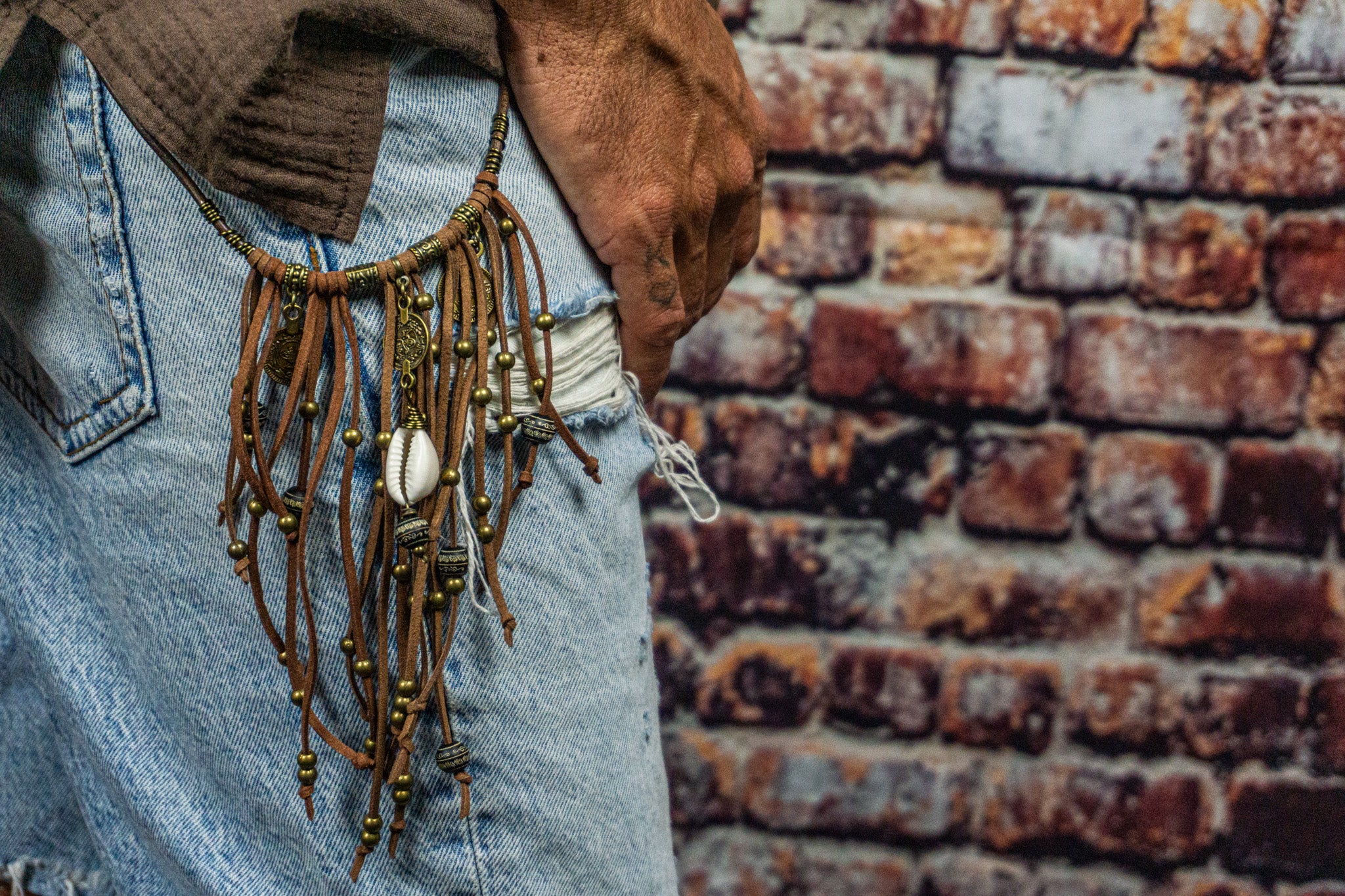 mens leather pants chain with bronze dangle beads and charms with a cowrie shell- wander jewellery