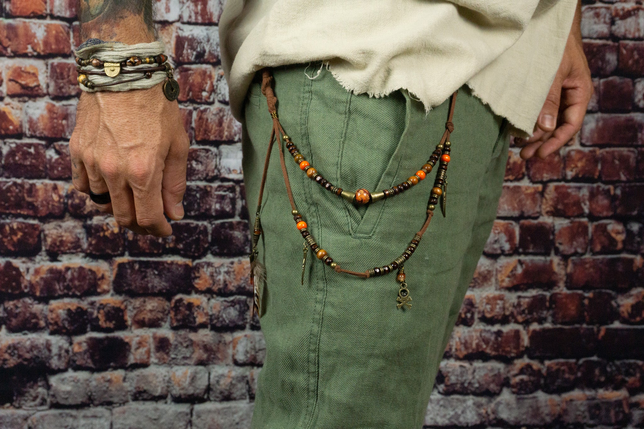faux leather and wooden bead layered pants keychain with feathers and bronze charms- wander jewellery