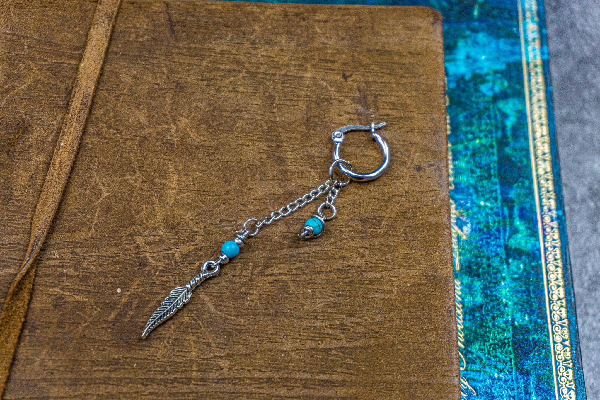 hoop earring with long chain, turquoise gemstone and steel feather- wander-jewellery