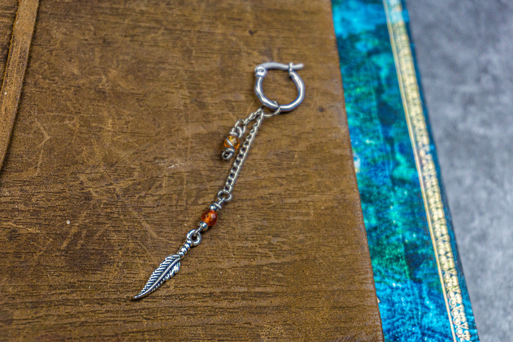 hoop earring with long chain, agate gemstone and steel feather- wander-jewellery