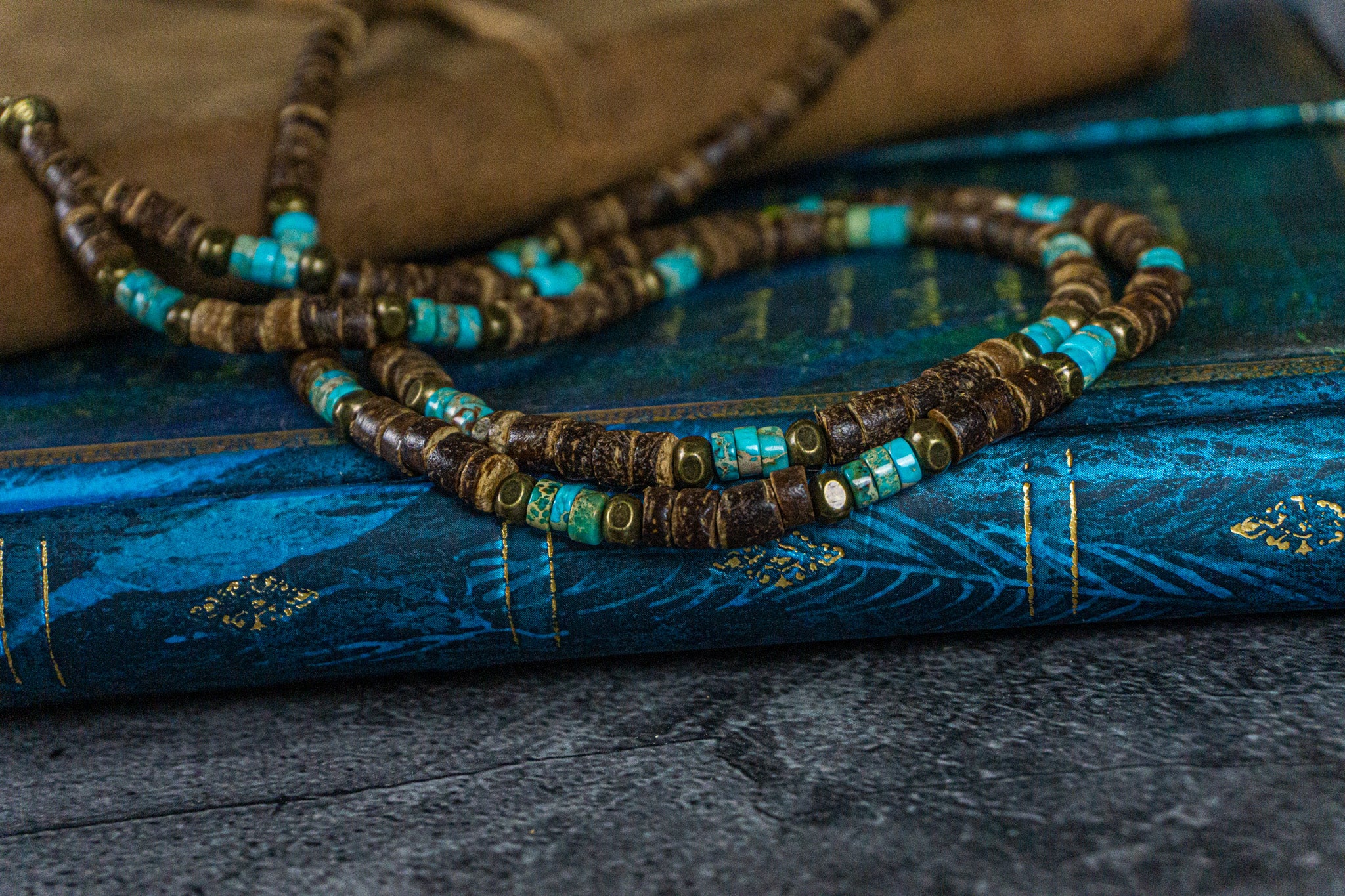 extra long coconut and turquoise gemstone bead, with a long tribal multi charm pendant- wander jewellery
