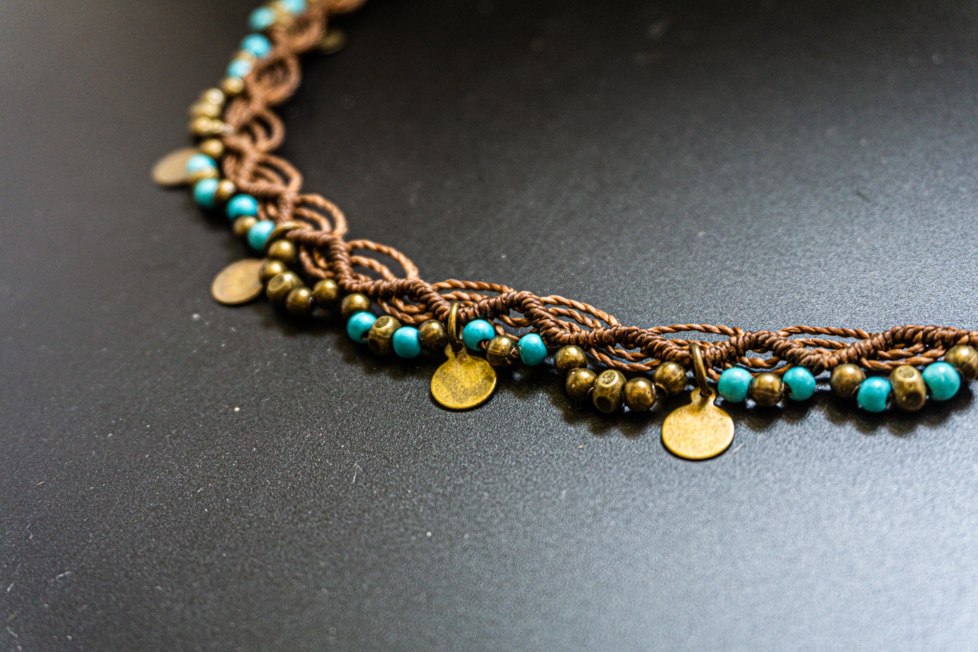 macrame anklet with turquoise gemstone beads and brass charms- wander jewellery