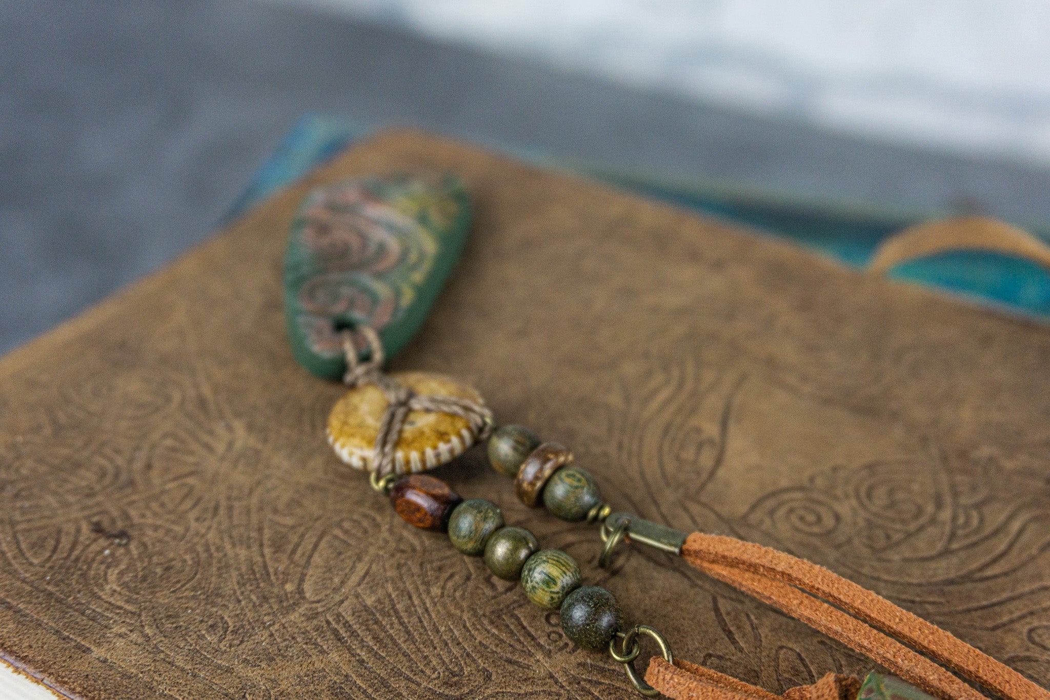 long necklace with handmade polymer clay green pendant and wooden and brass details- wander jewellery
