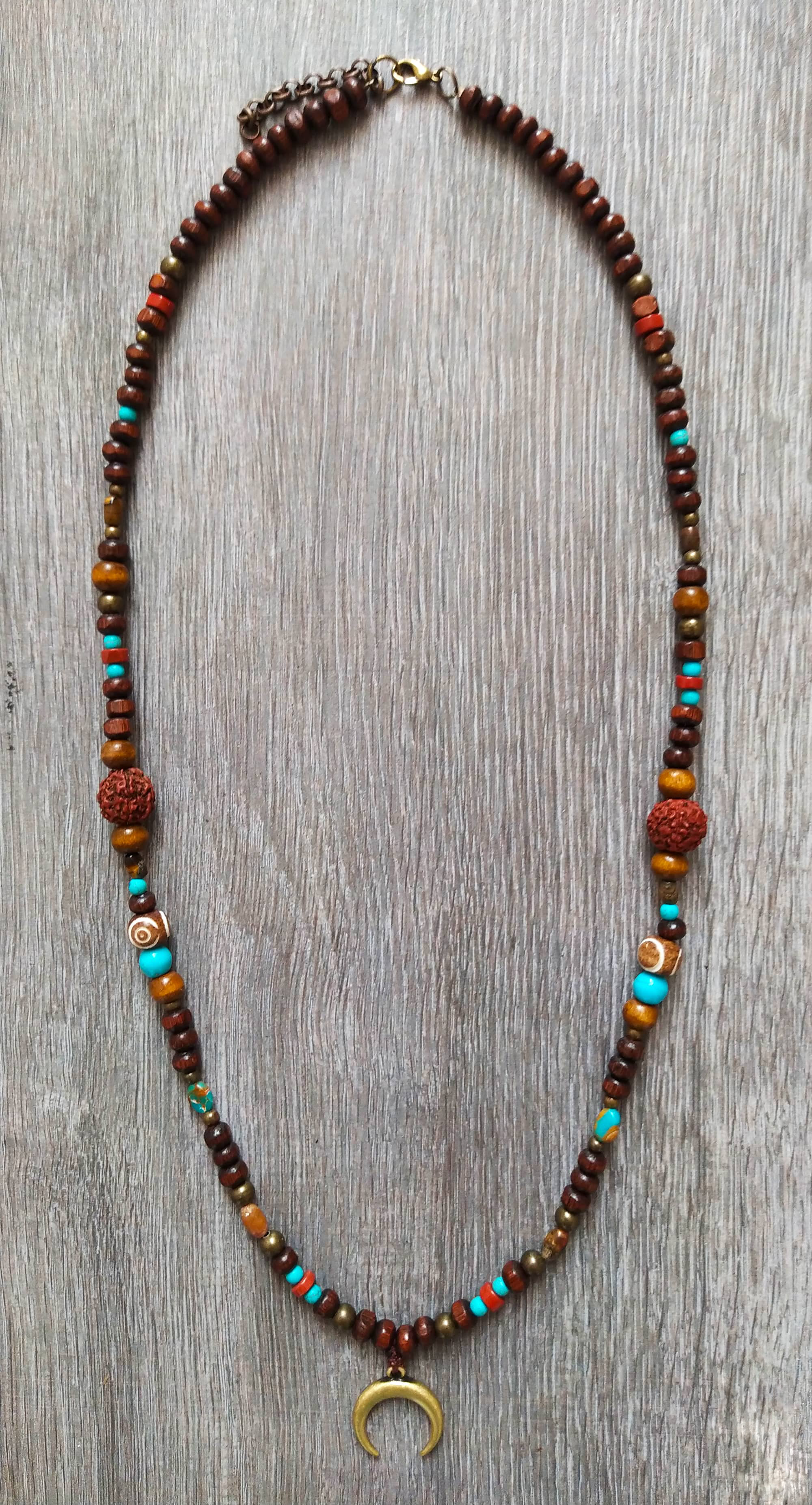 wooden bead and gemstone necklace woth rudraksha and a bronze moon pendant- wander jewellery