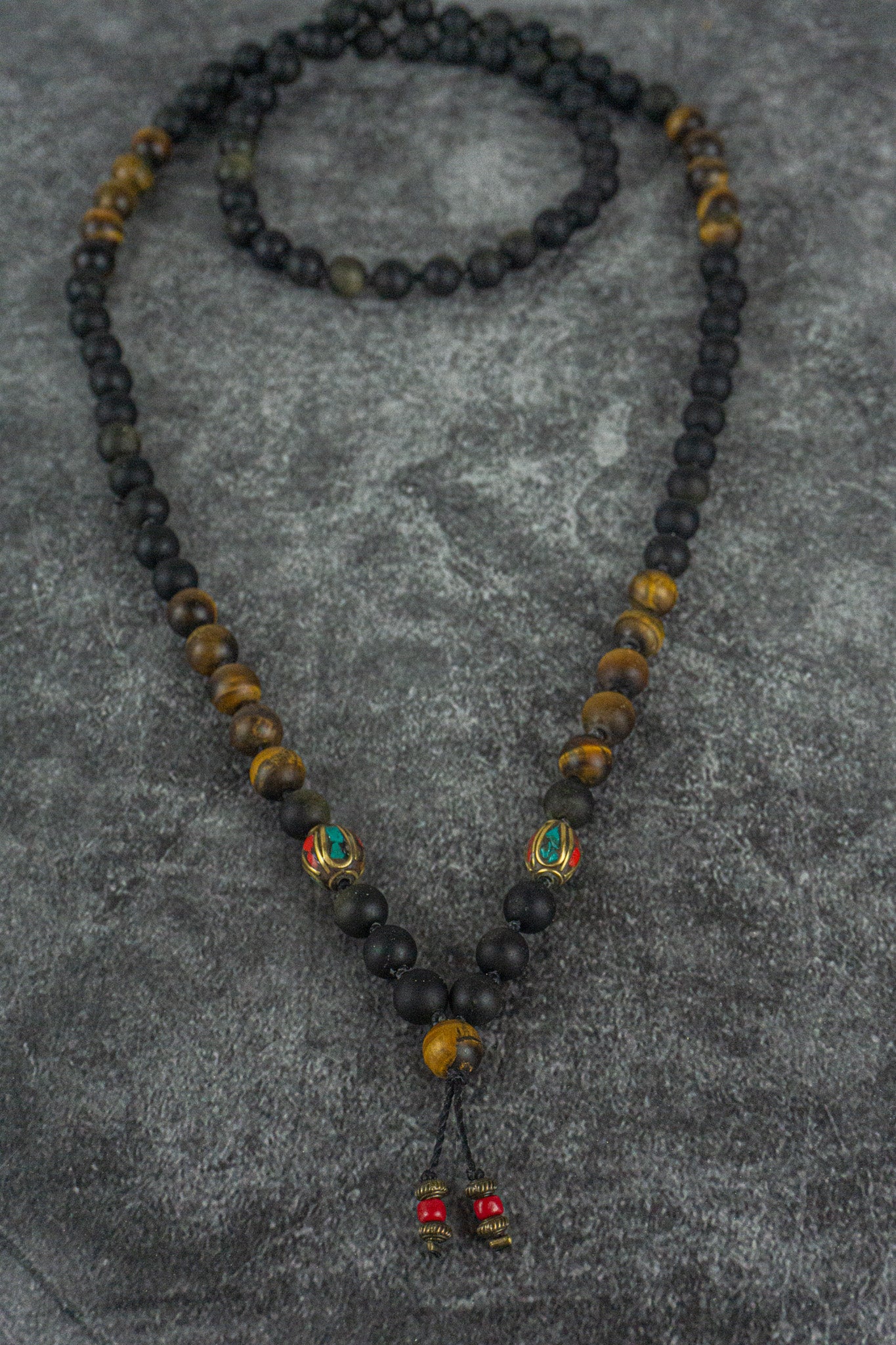 long mala necklace made of golden obsidian and frosted tiger eye gemstones, with tibetan beads decorations- wander jewellery