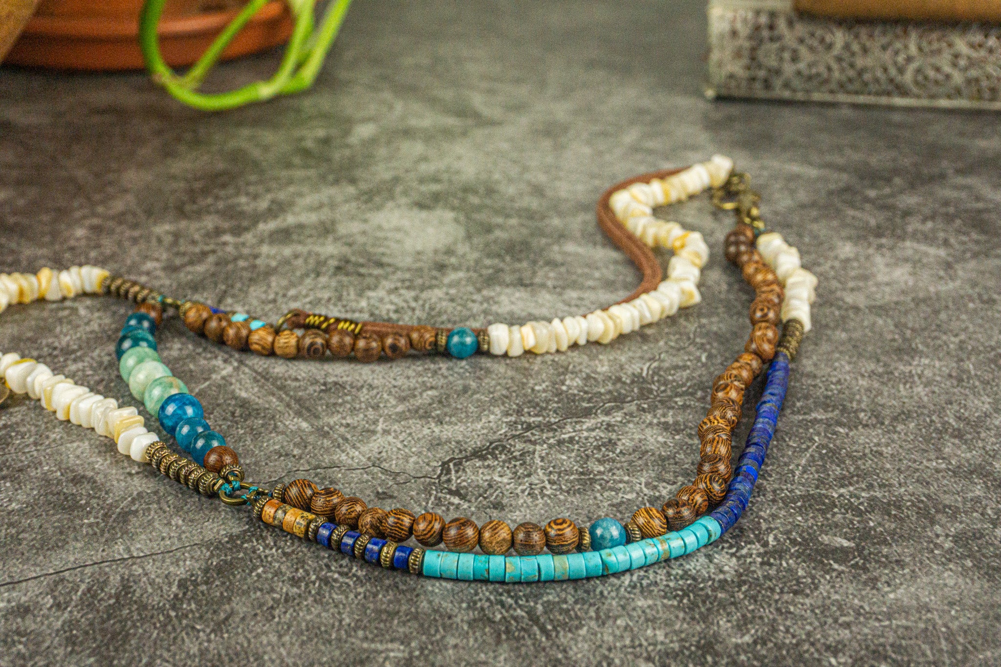long layered necklace made of gemstones white coral, wood and leather- wander jewellery