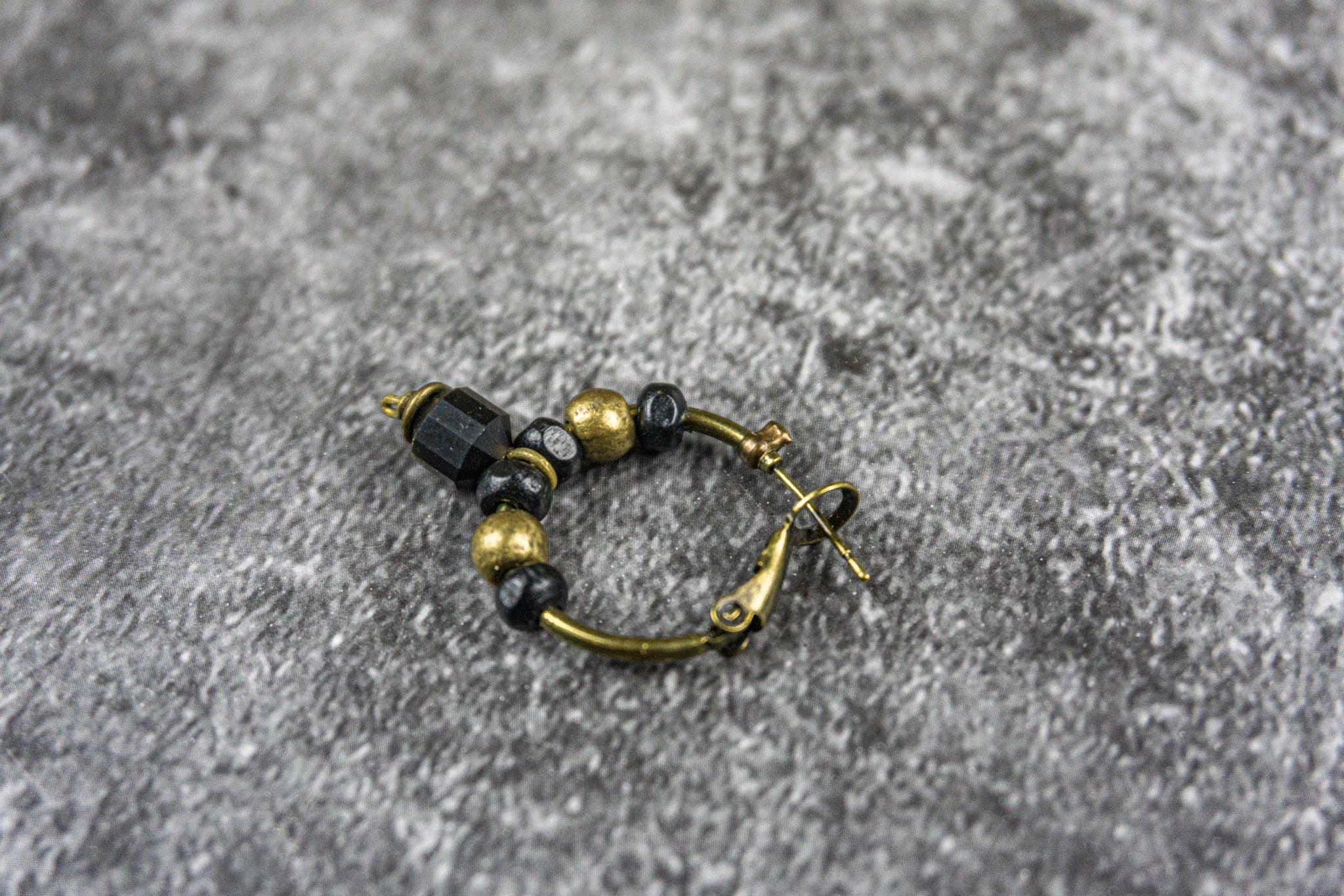 hoop earring with black wooden bead and golden obsidian gemstone - wander jewellery