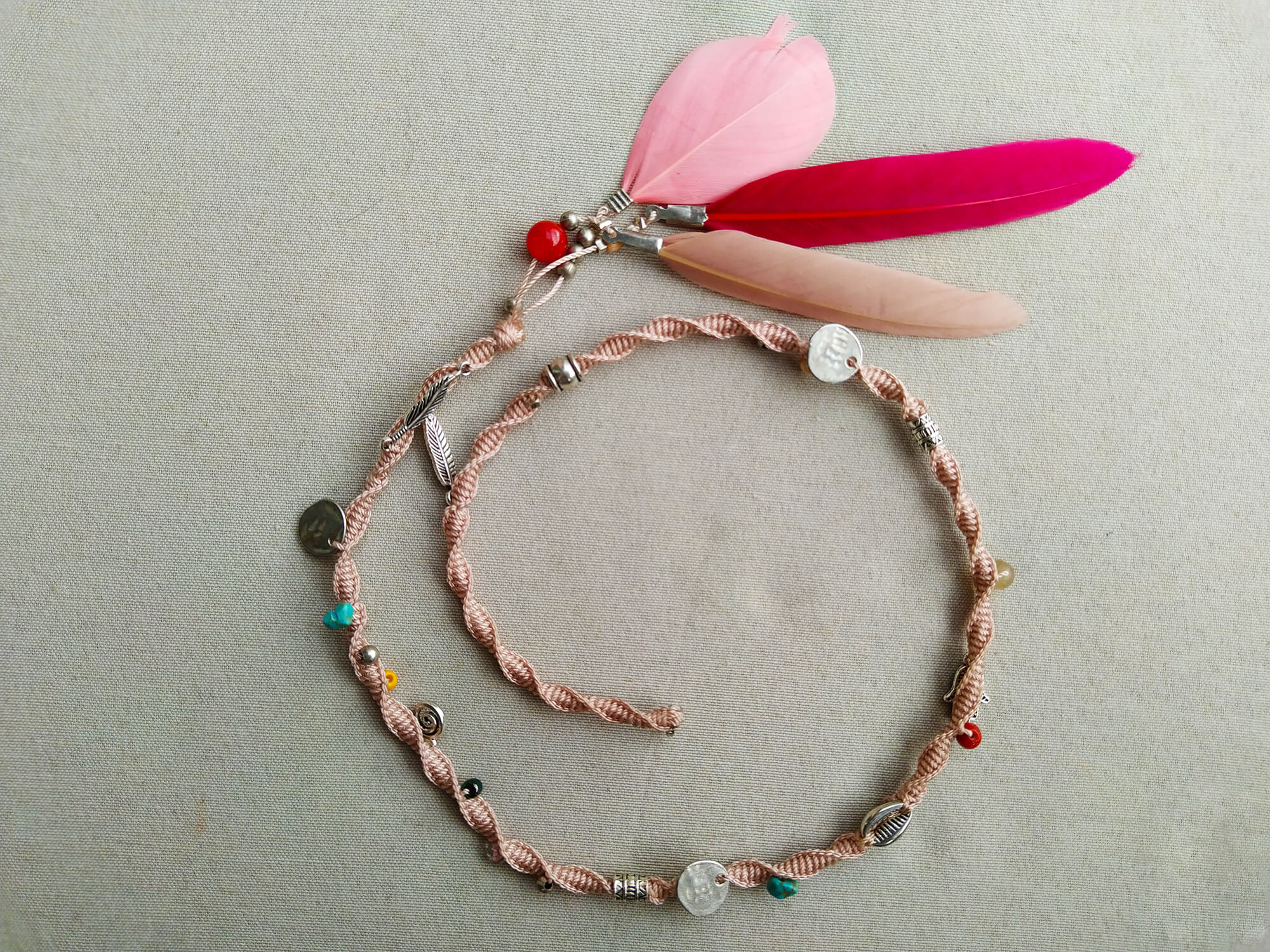 light pink woven macrame hair wrap with charms and pink feathers- wander jewellery