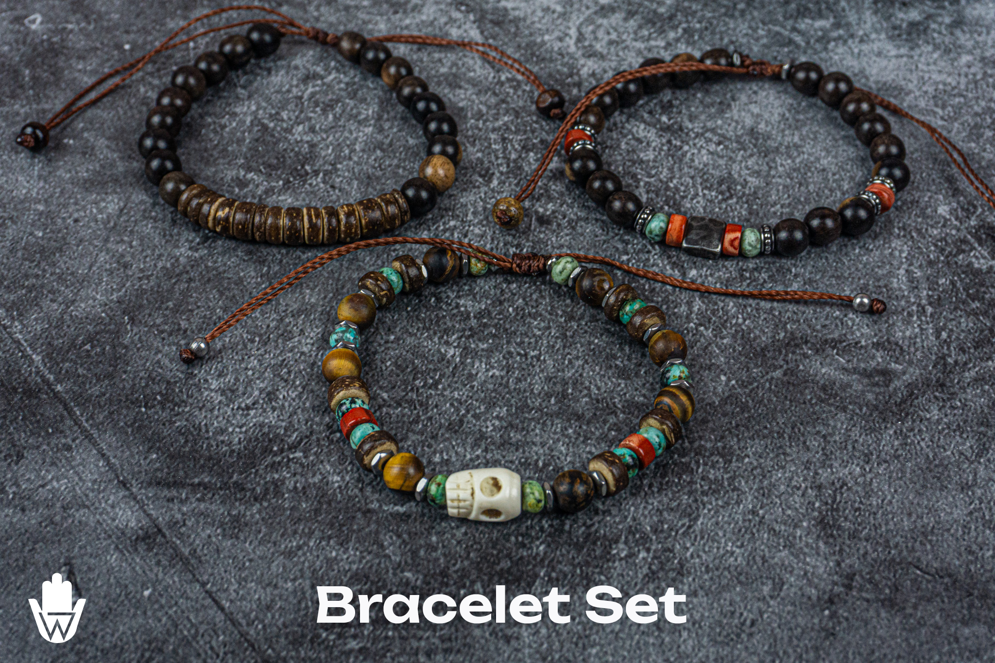 bracelet set of 3 made of ebony wood, coconut, gemstones, with a skull charm as central piece- wander jewellery