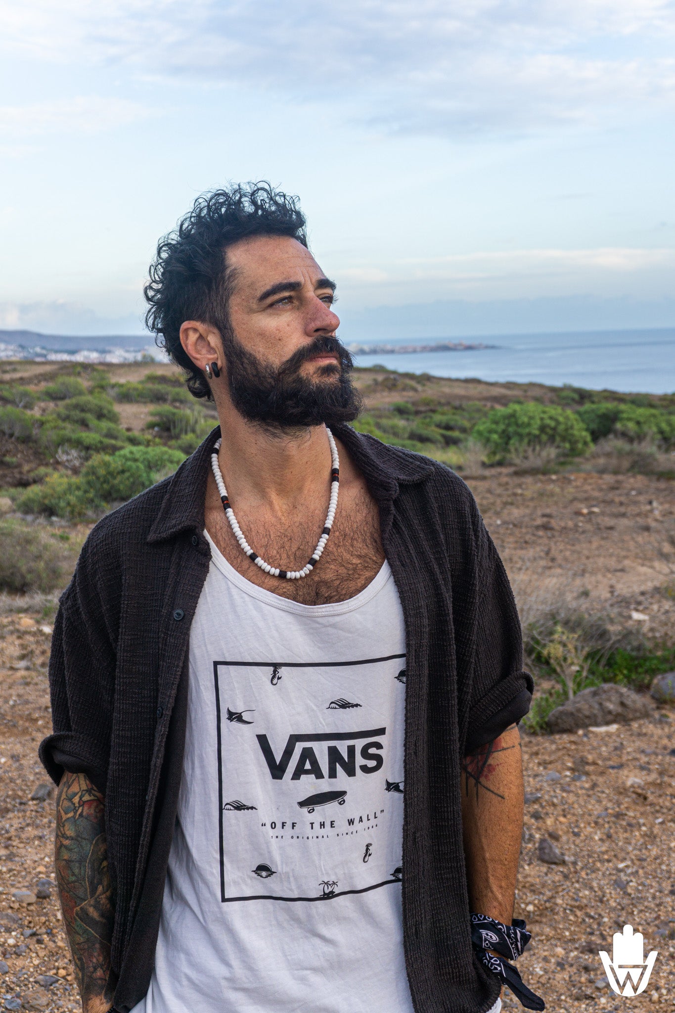 mens wearing sports clothes  and a necklace in a natural landscape 