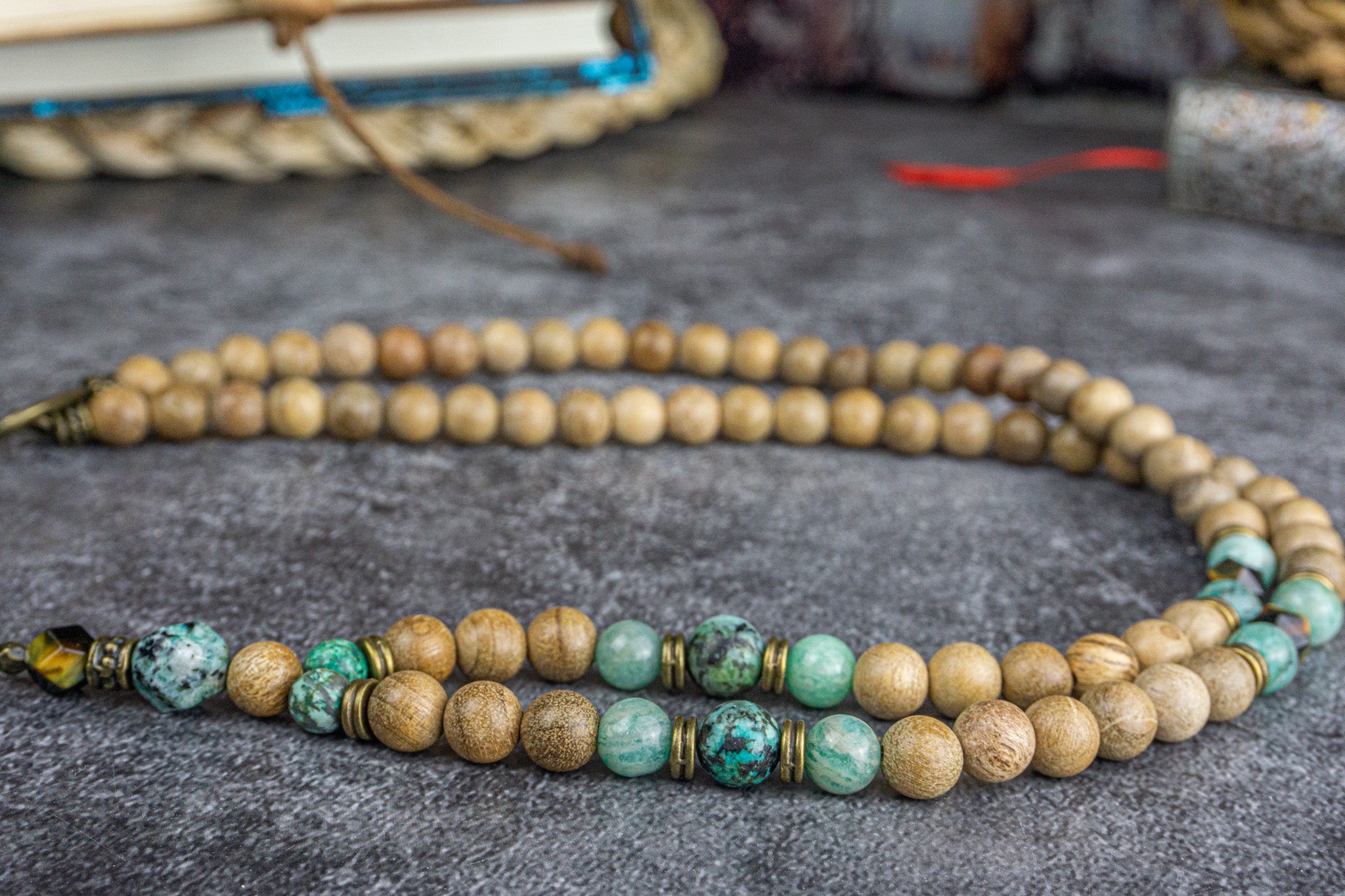 close picture of a camphor wood, amazonite, jasper and tiger eye gemstone beaded boho tibetan necklace