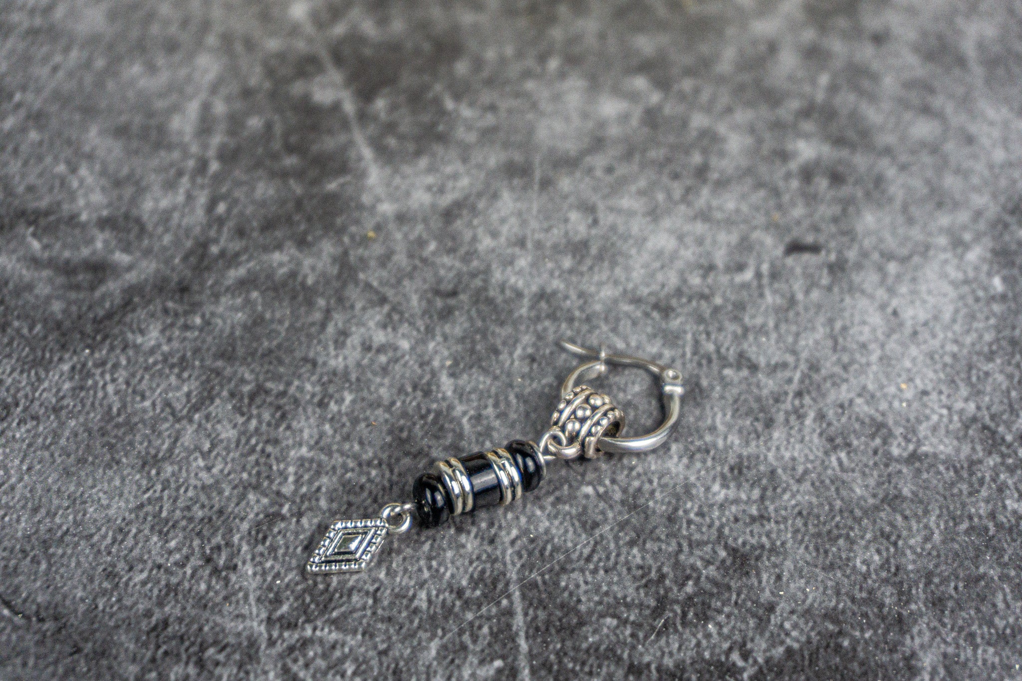 Silver earring with stainless steel hoop and onyx gemstones