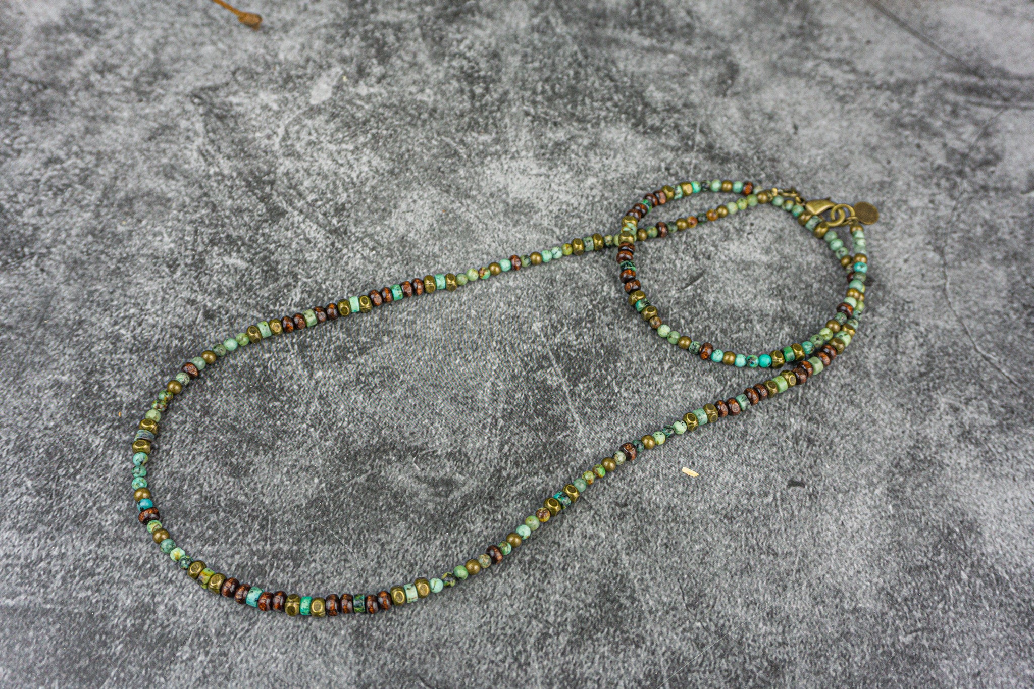 Long dainty green african turquoise, woodand brass beaded necklace 