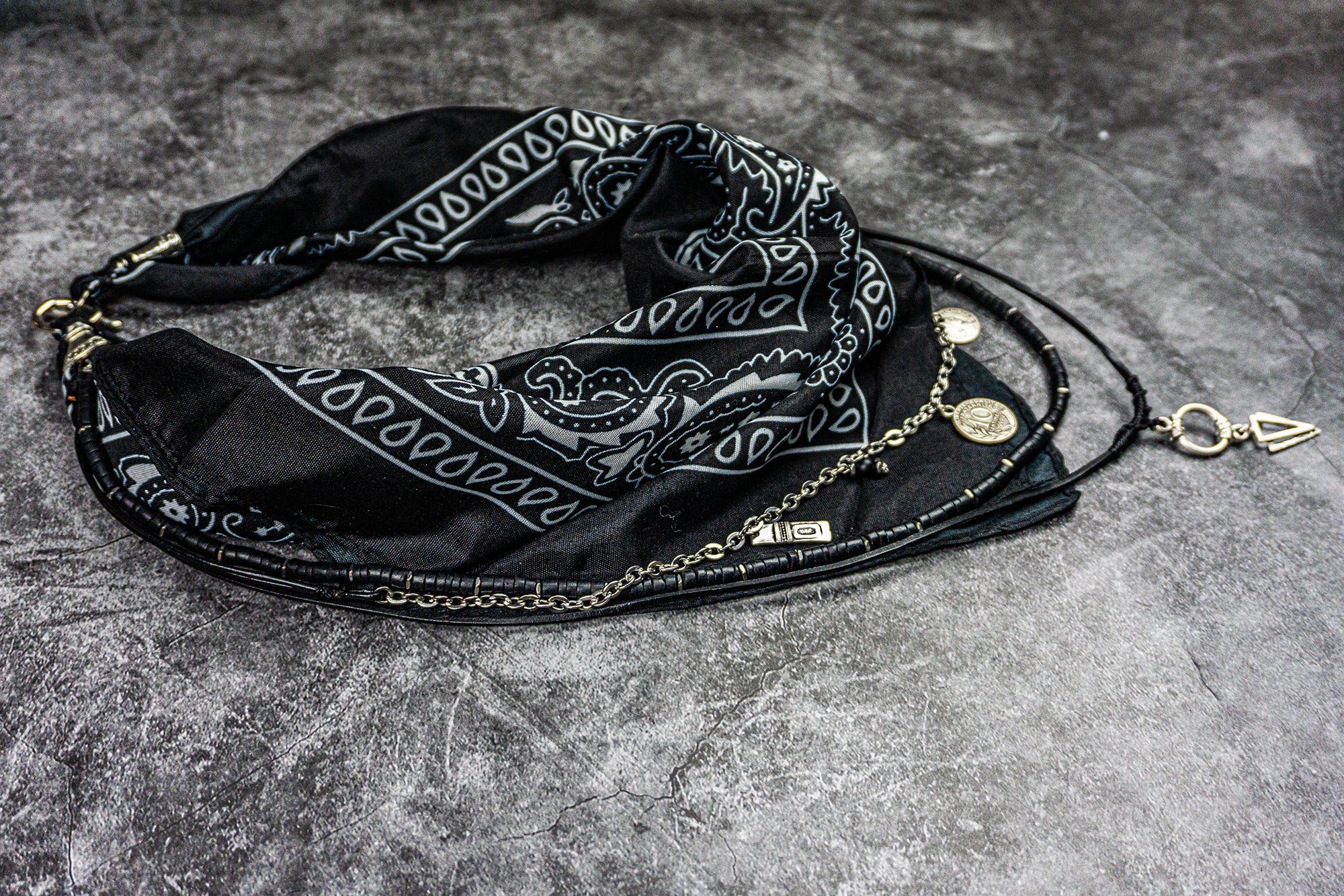 black bandana layered necklace made of stainless steel chain strand with charms, , lblack leather strand with arrowed pendant and black coconut strand