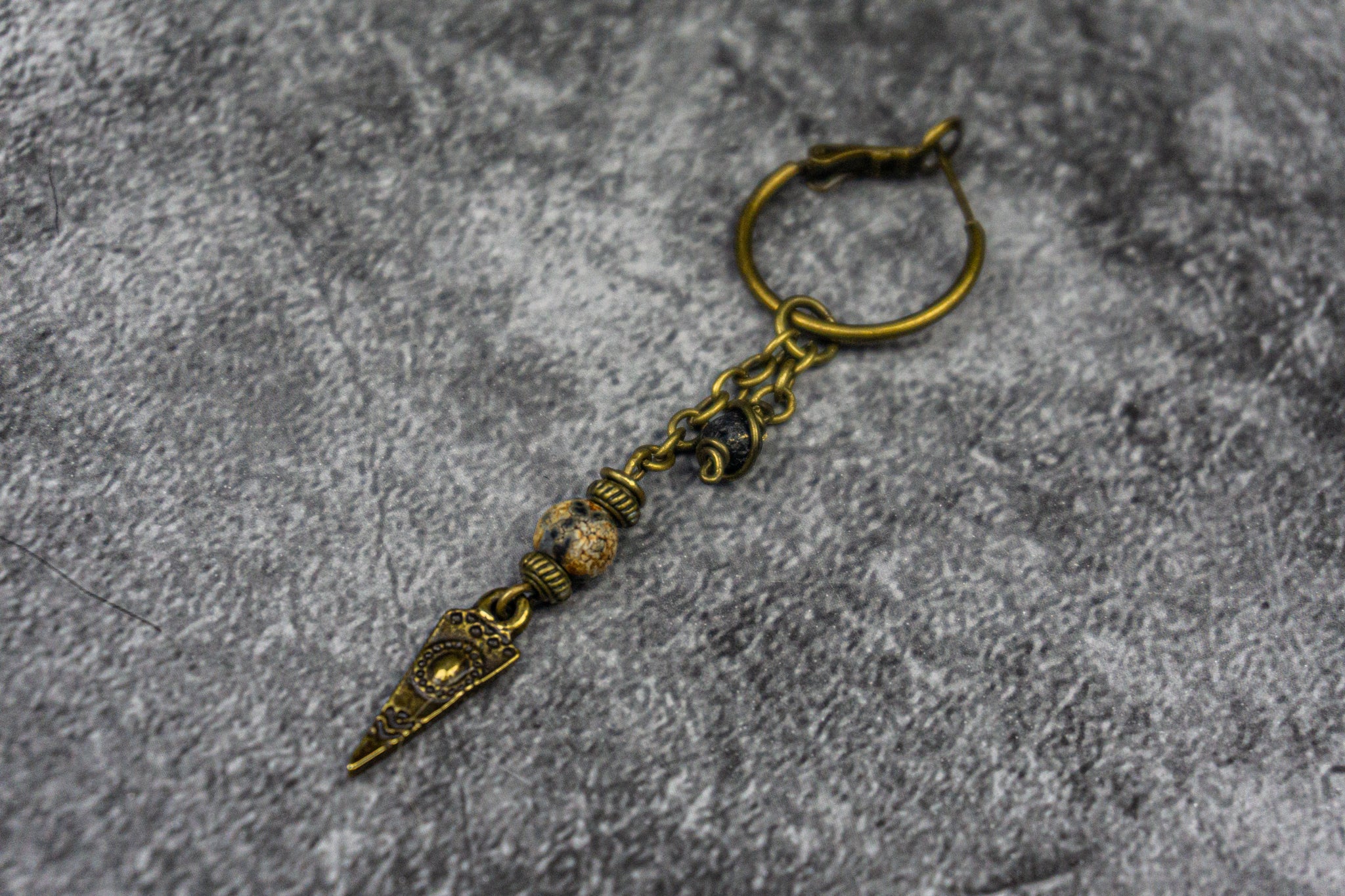 brass hoop earring with chain, gemstone beads and dangle charm