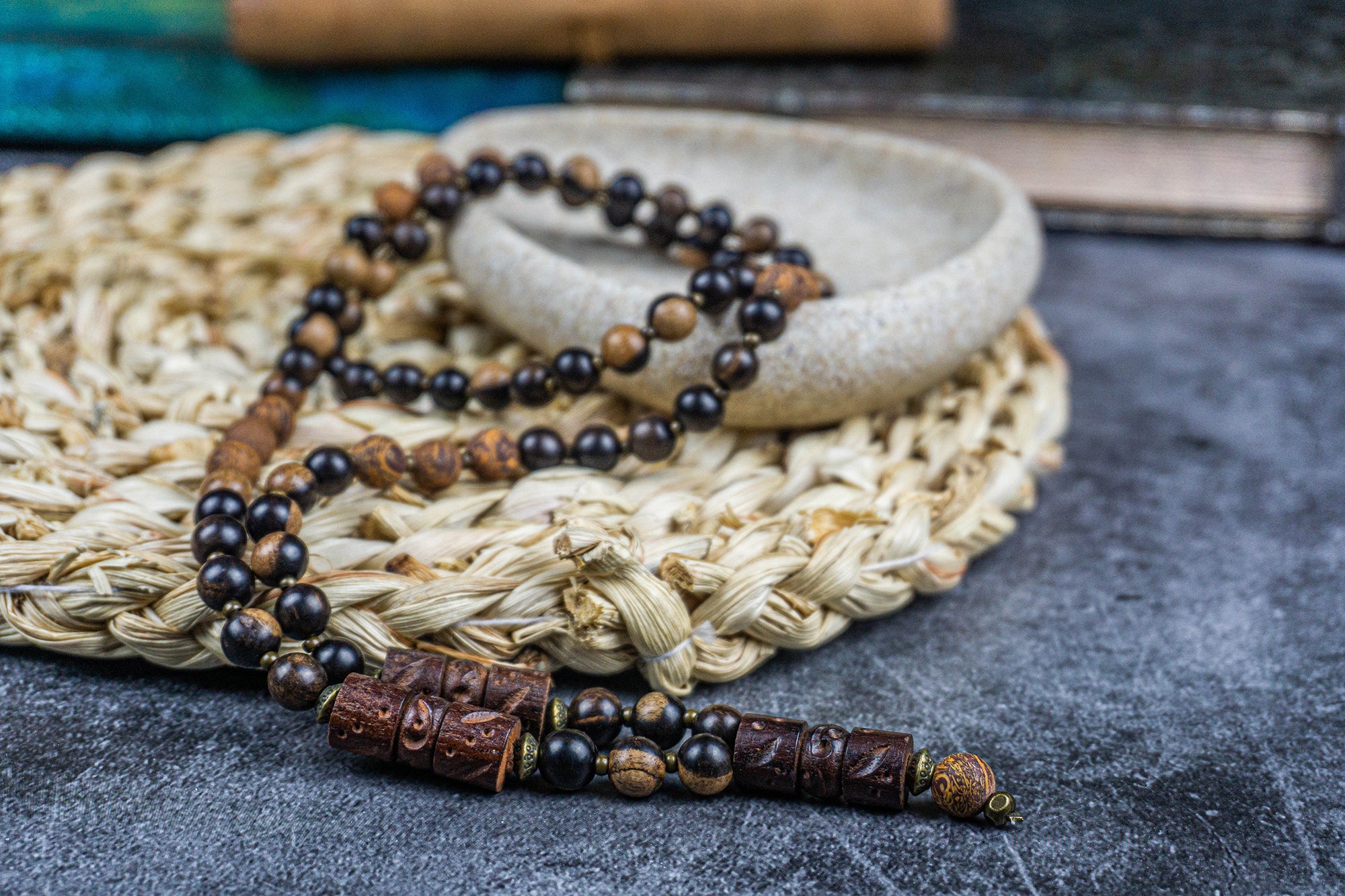 dark ebony wood and elephant skin beaded necklace with bronze details and three carved ebony wood pieces