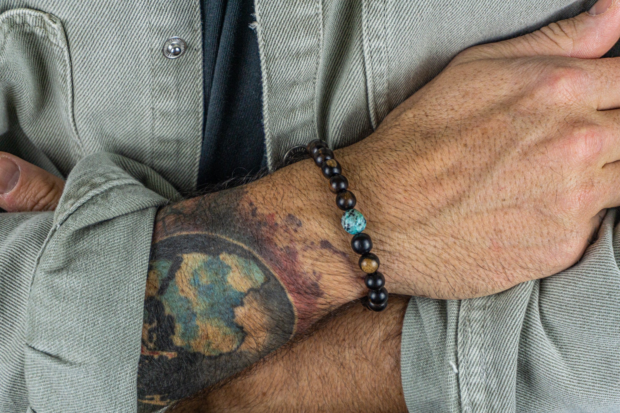 ebony wood beaded bracelet with cental sesame kiwi jasper gemstone bead