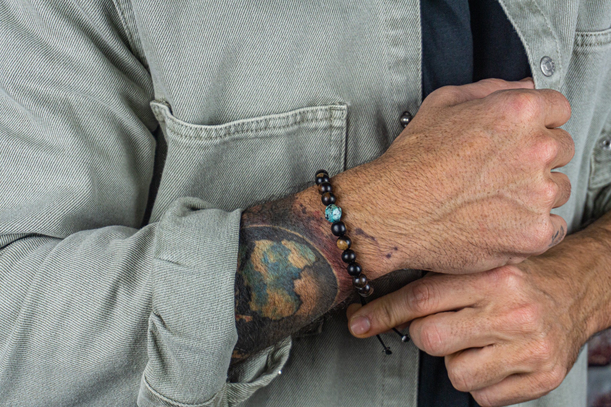 mens ebony wood beaded bracelet with cental kiwi jasper gemstone bead