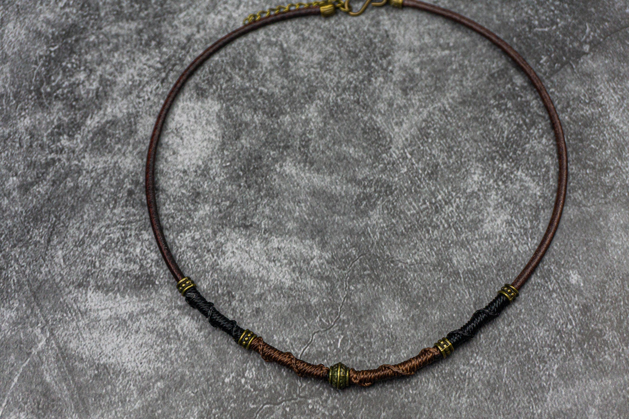 brown chunky choker necklace for men and women with bronze details and woven cotton thread decoration