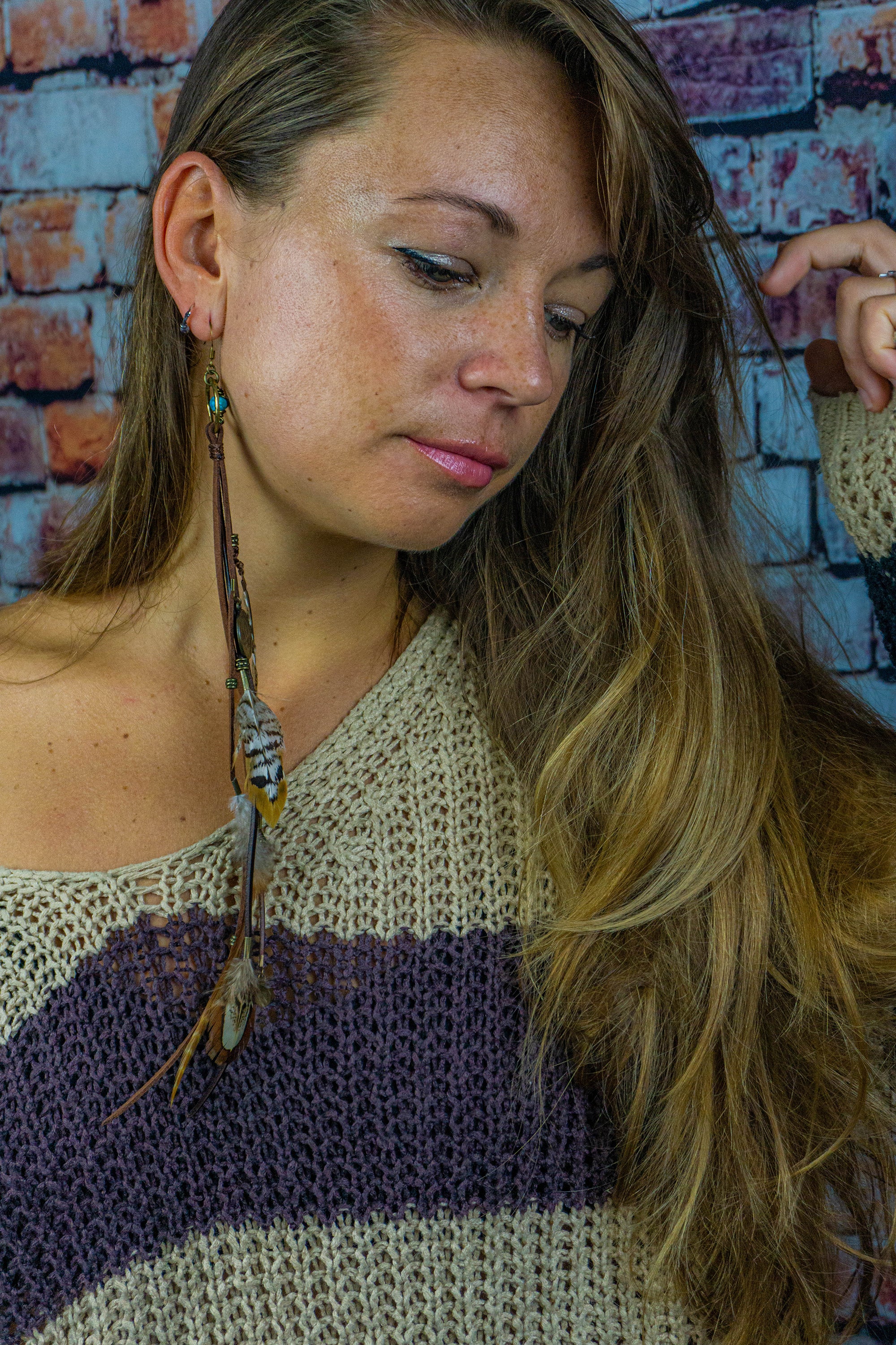 girls long bohoearring made of leather and feathers-wander jewellery