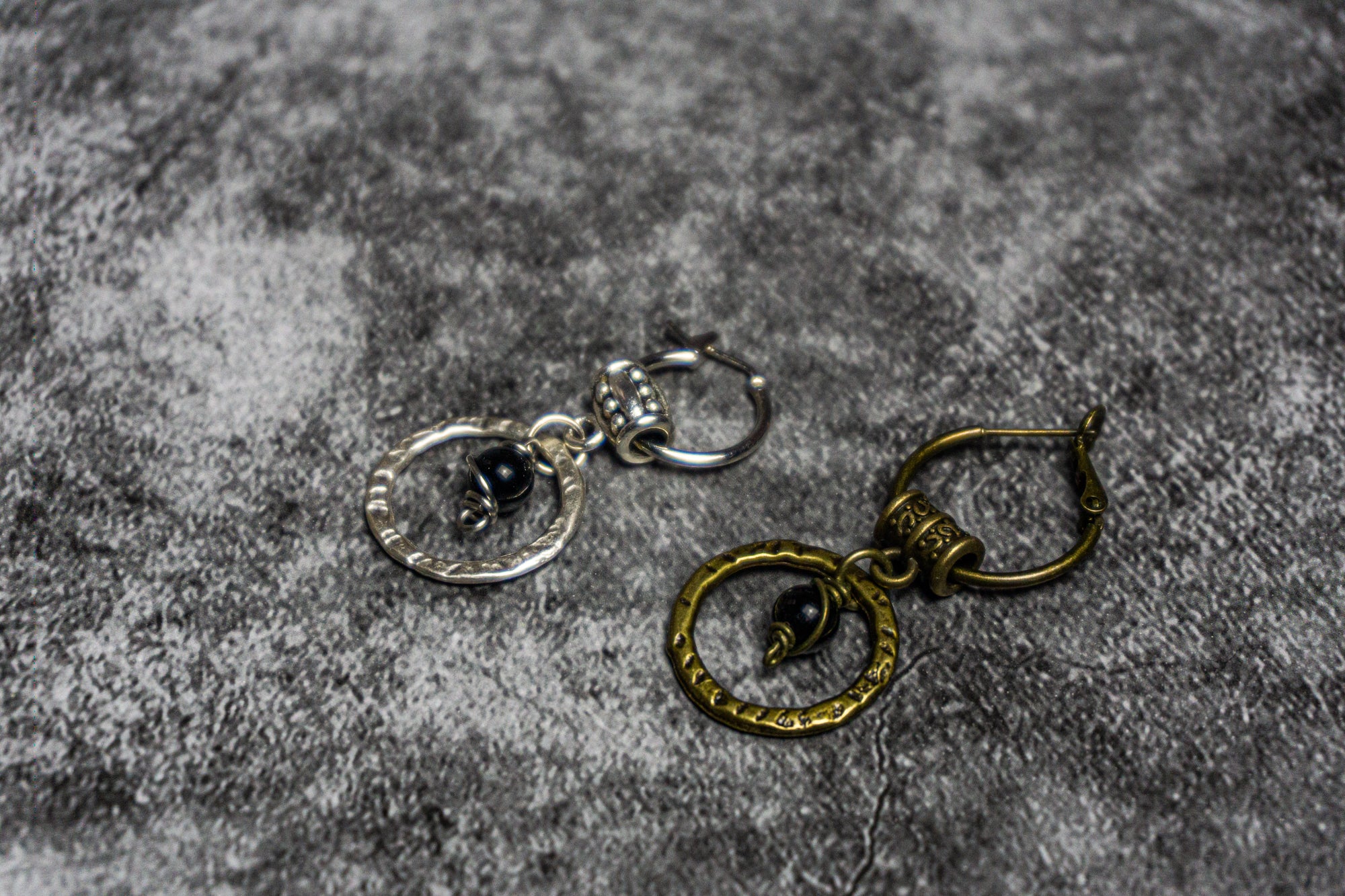 siver and bronze model hoop dangel earring with a black onyx gemstone pearlearring