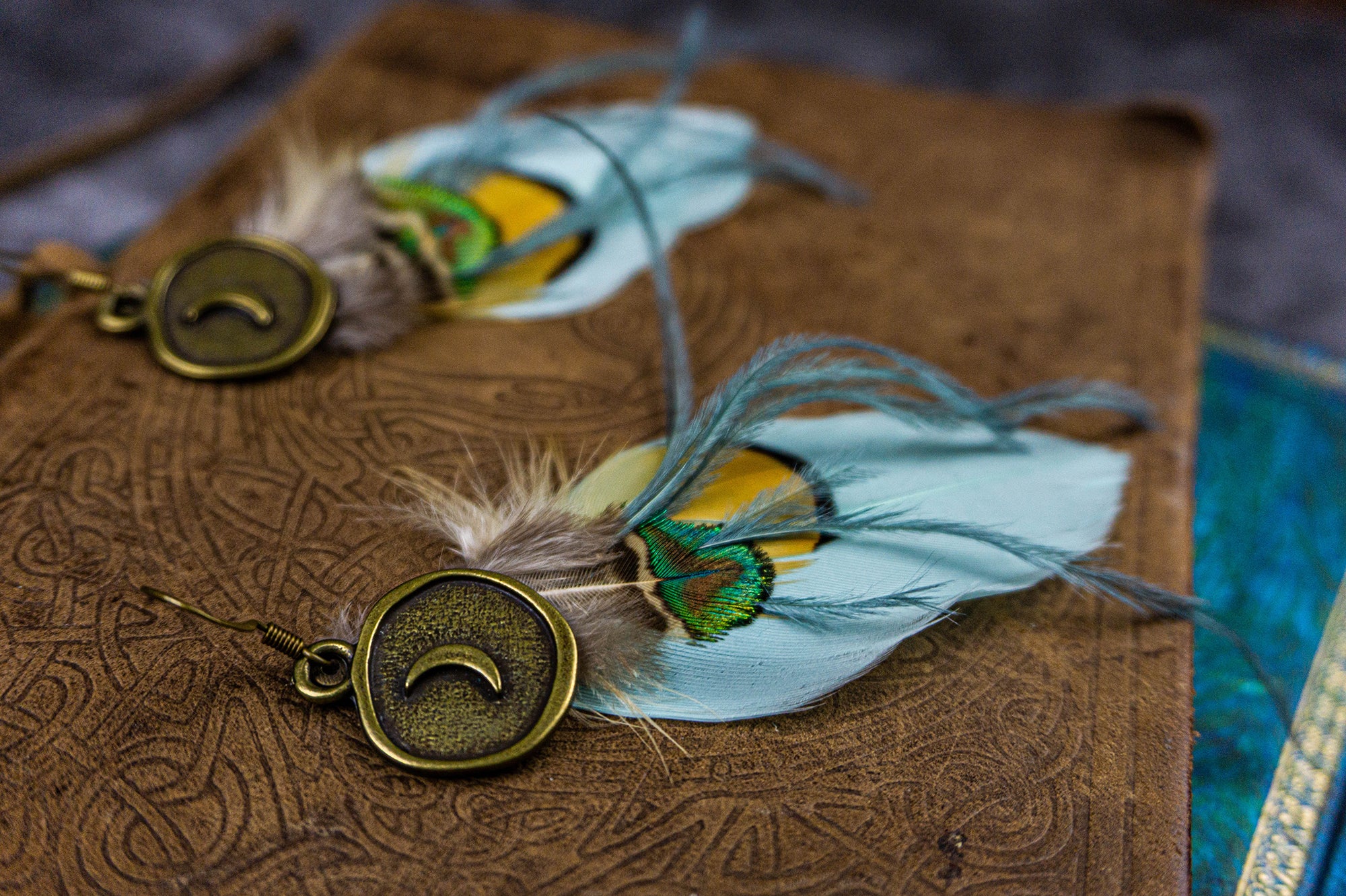 turquoise real feathers long boho earring with a bronze  dangle moon coin