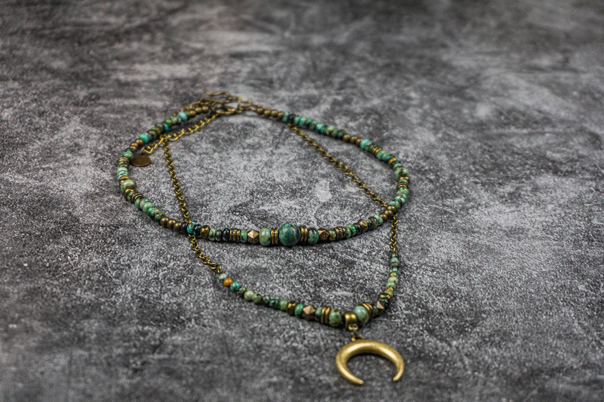 womens boho double necklace set made of green african turquoise and jade, with a crescent moon bronze pendant
